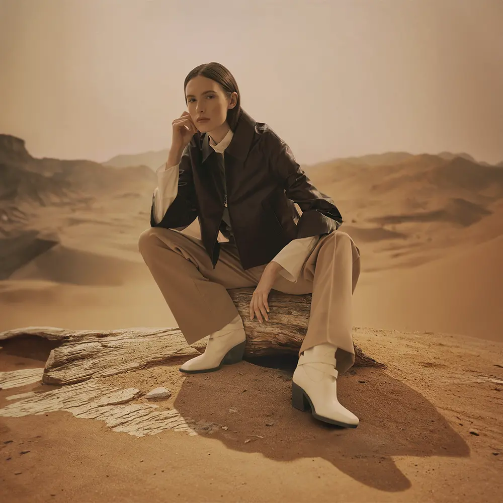  Black jacket with white blouse and brown trousers