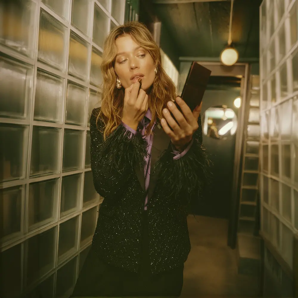 Glitter blazer with purple blouse