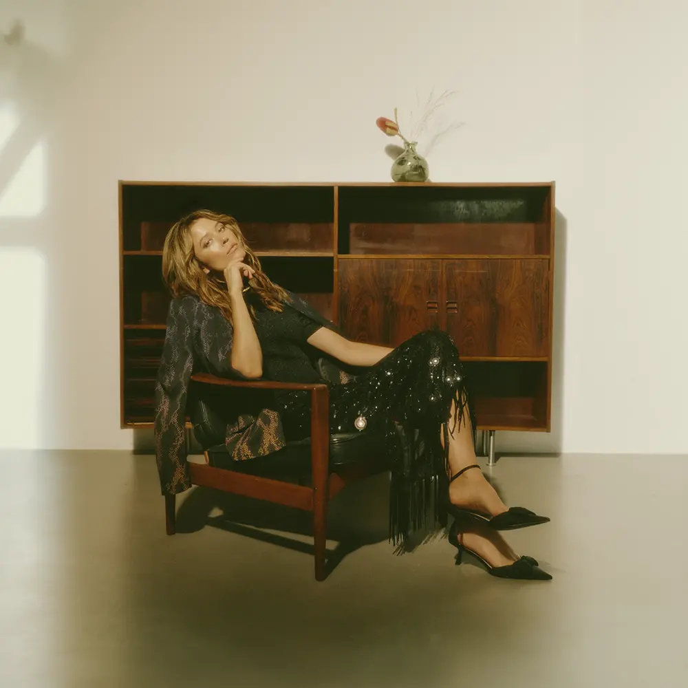 Blazer with snake print and glitter skirt in black