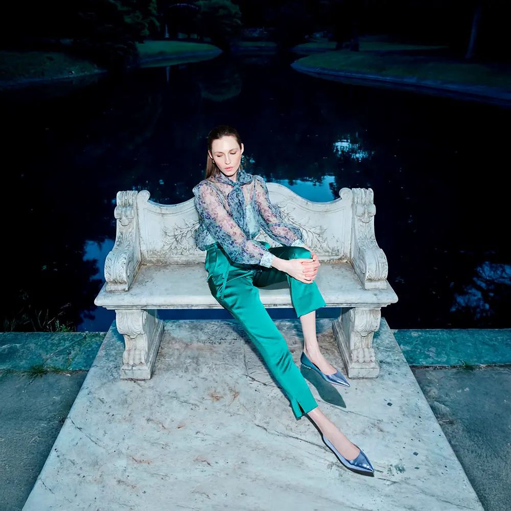 Sheer blouse and green trousers
