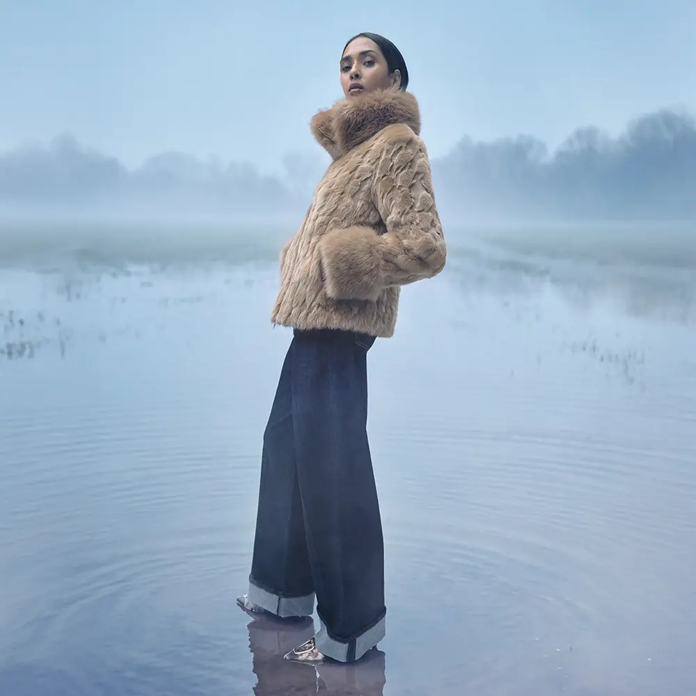 Faux fur meets rolled-up denim and pointed-toe pumps