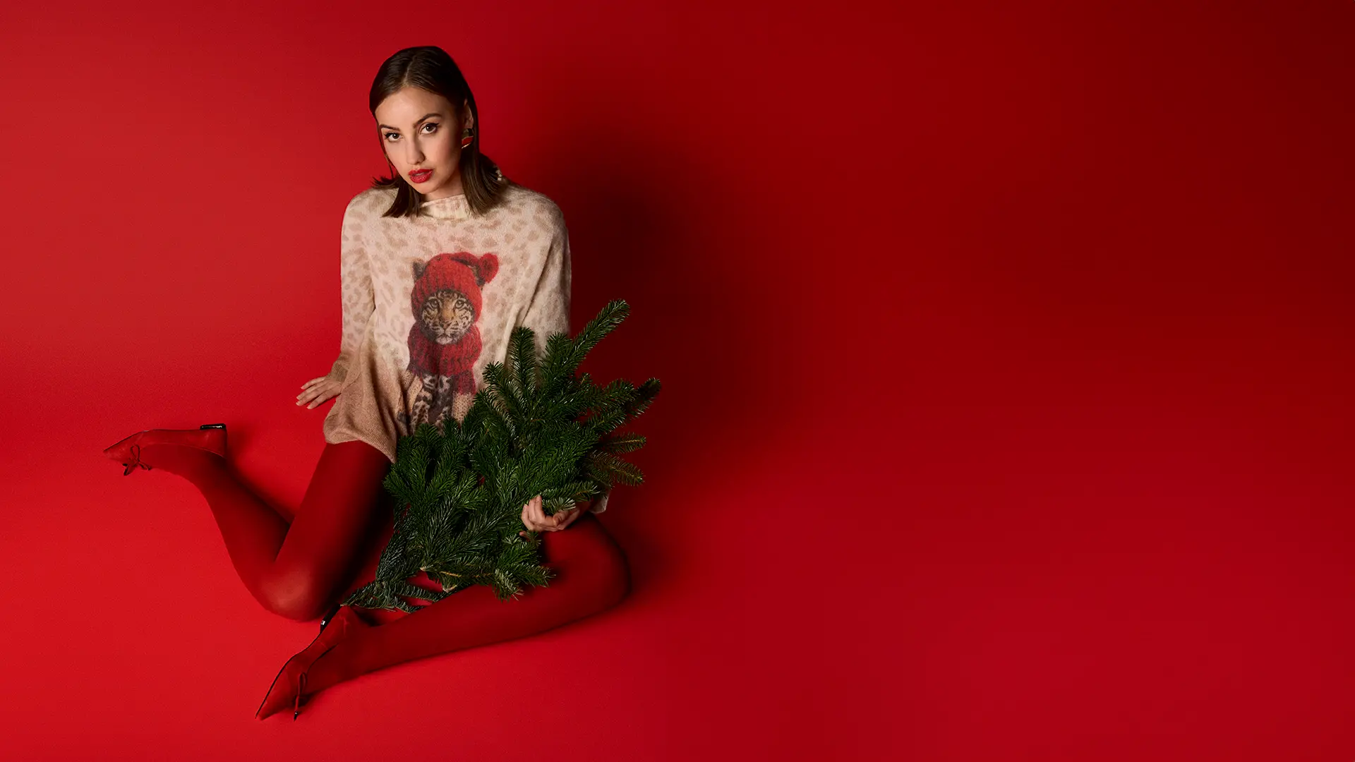 Pull de Noël luxueux avec motif bébé léopard dans un look hivernal « Knitted in Germany »