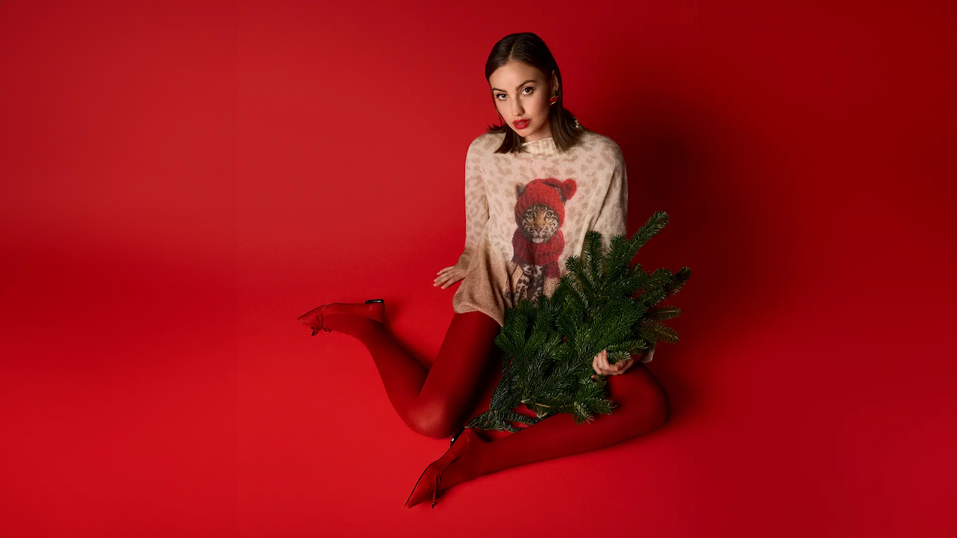 Pull de Noël luxueux avec motif bébé léopard dans un look hivernal « Knitted in Germany »