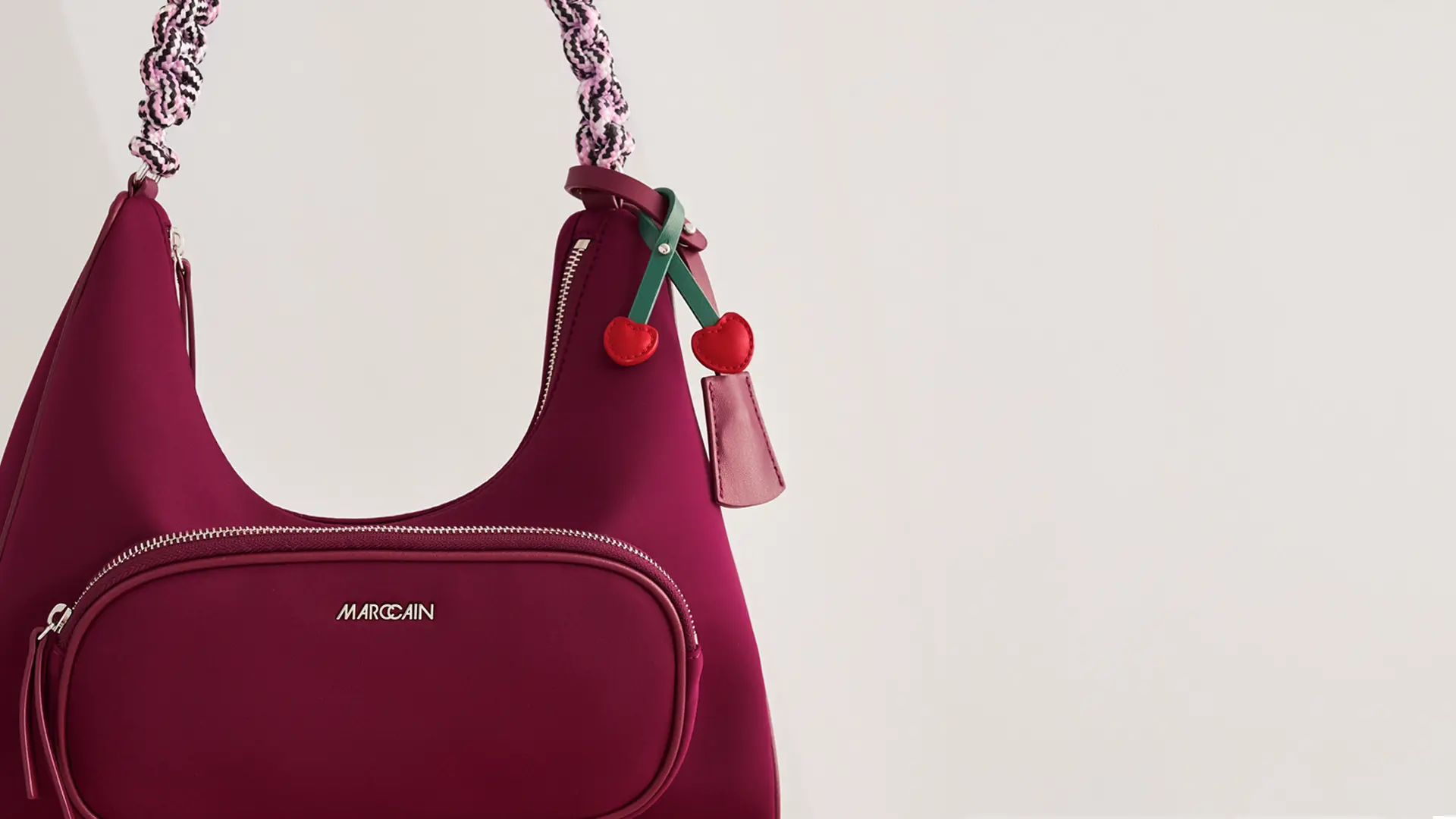 Neoprene shoulder bag with zips and braided handle