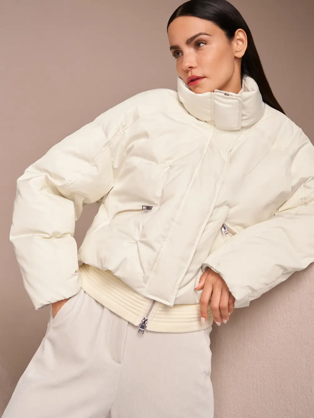 Quilted down jacket with knitted cuffs