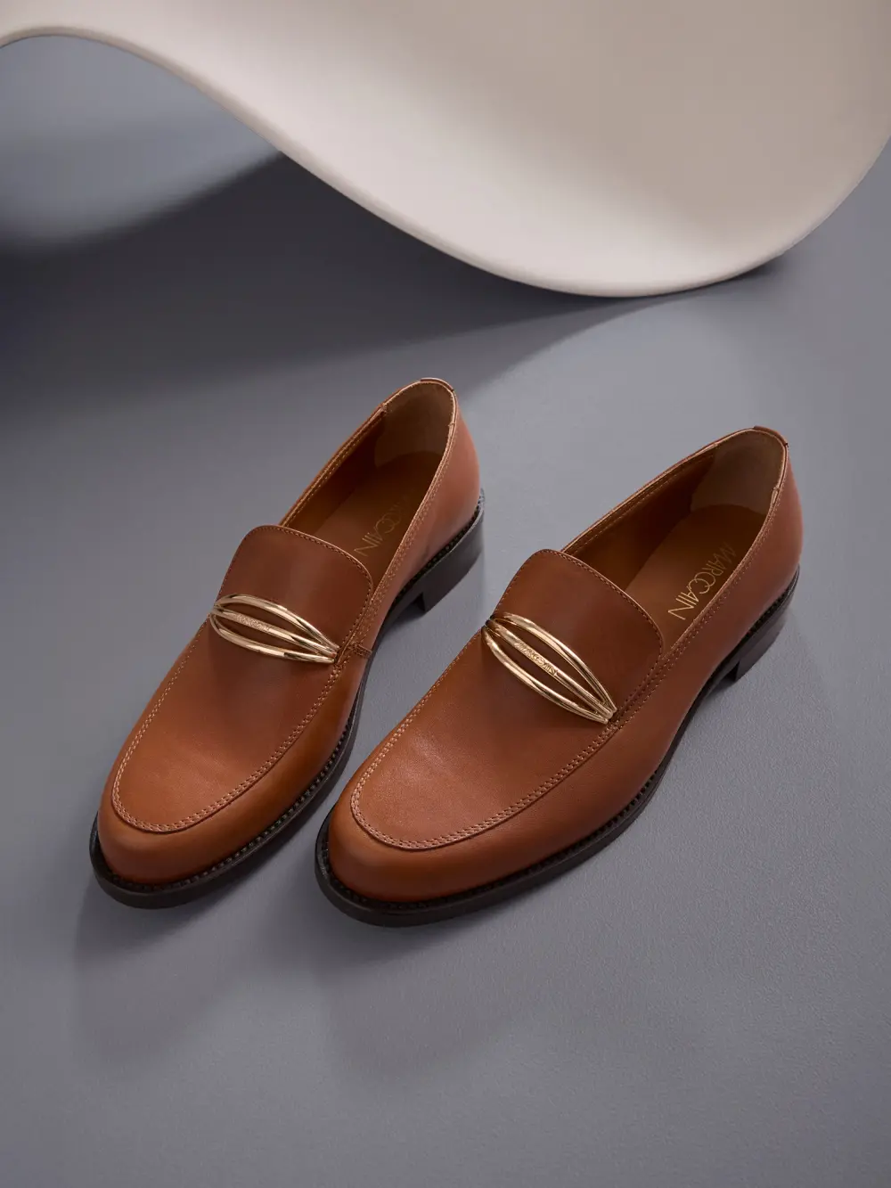Leather loafers with metal buckle