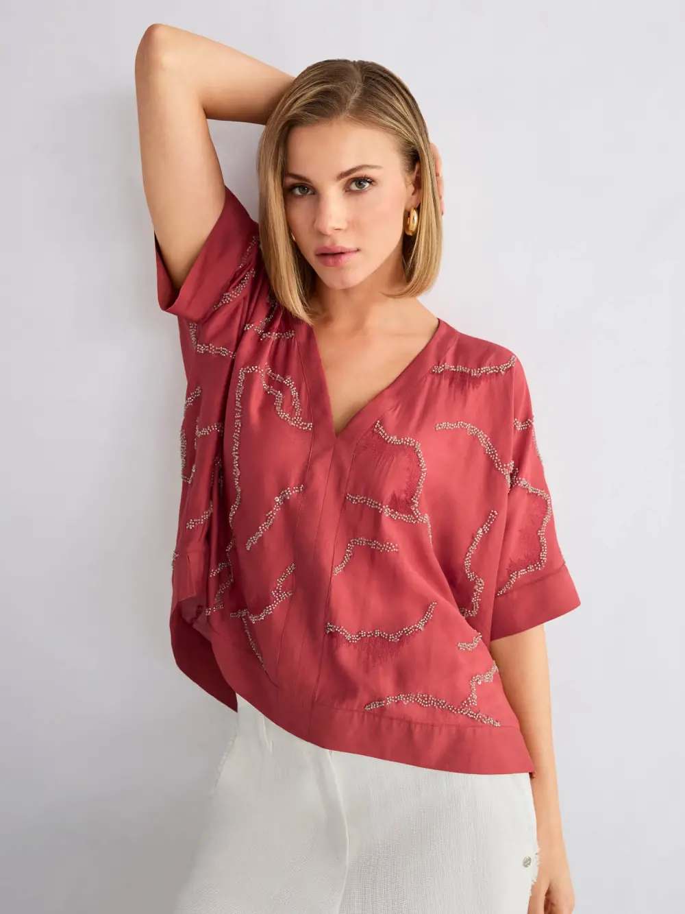 Flared blouse with embellishment