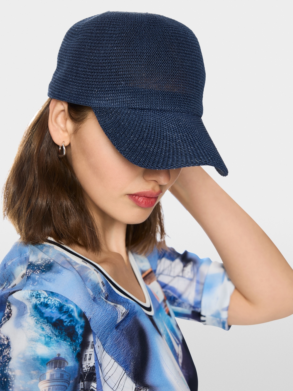 Cap with mesh look | marc-cain.com/en