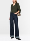 Flowing blouse with decorative button