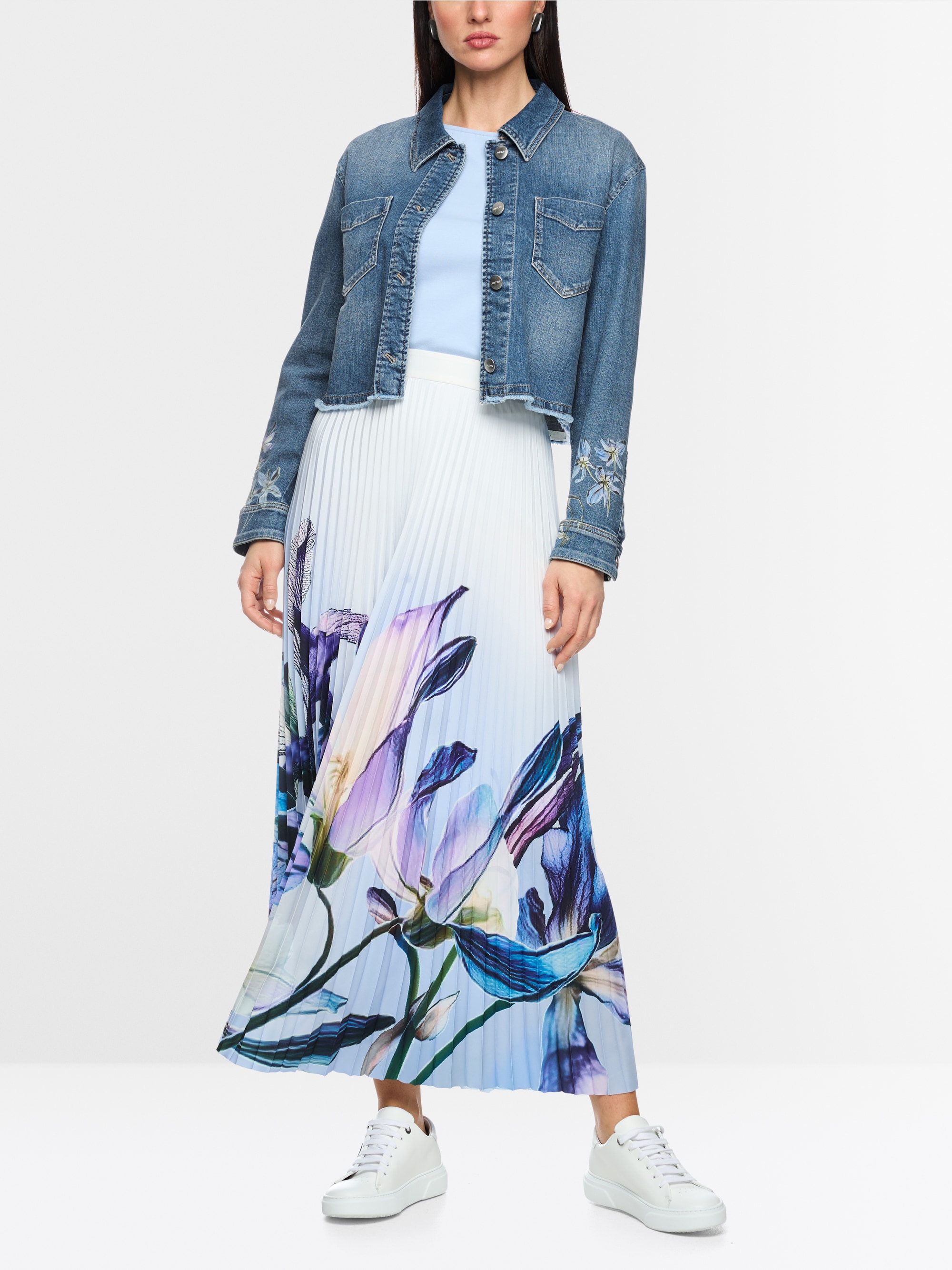 Denim jacket with floral print sleeves