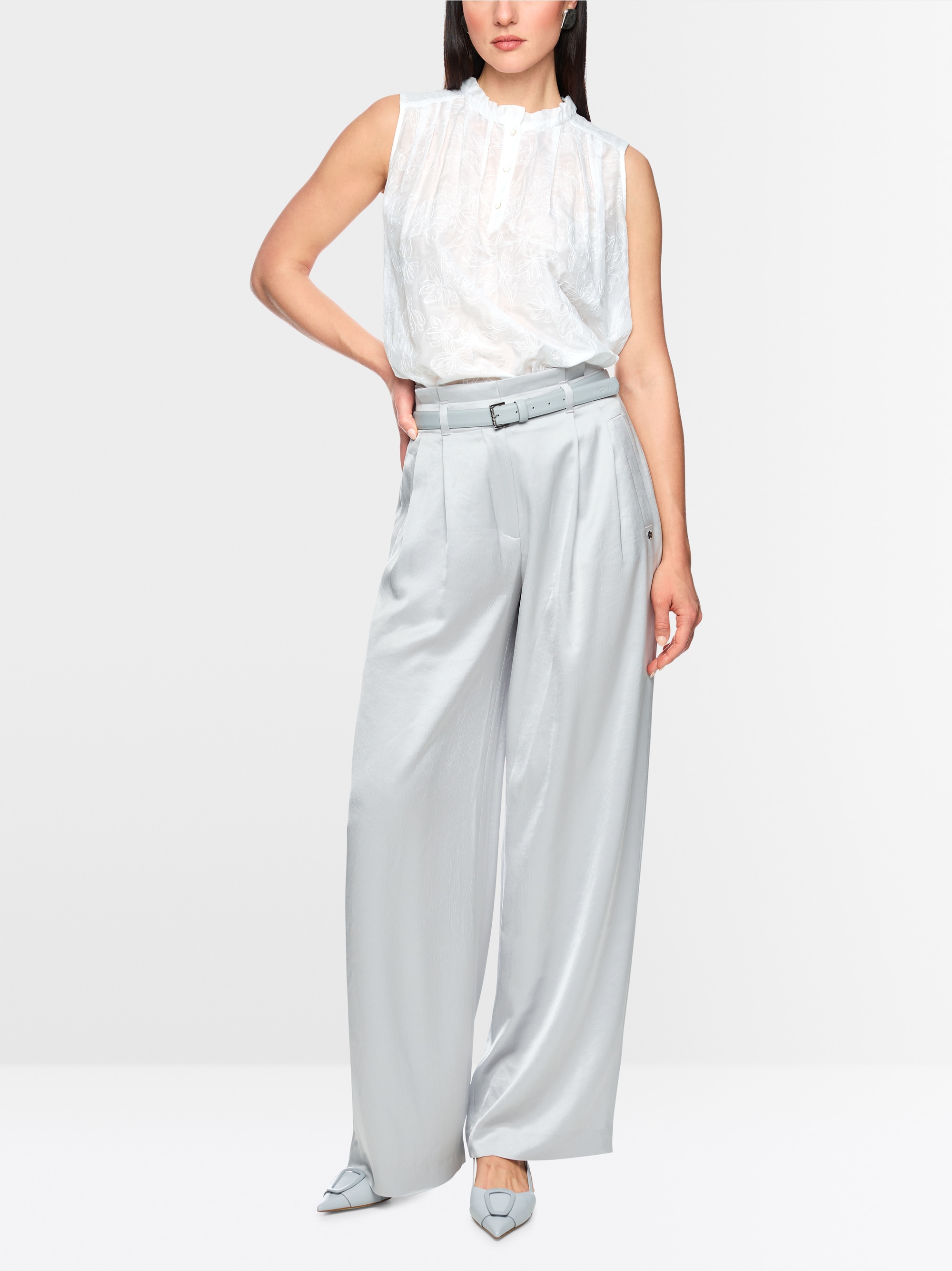 Top with ruffles & floral embroidery