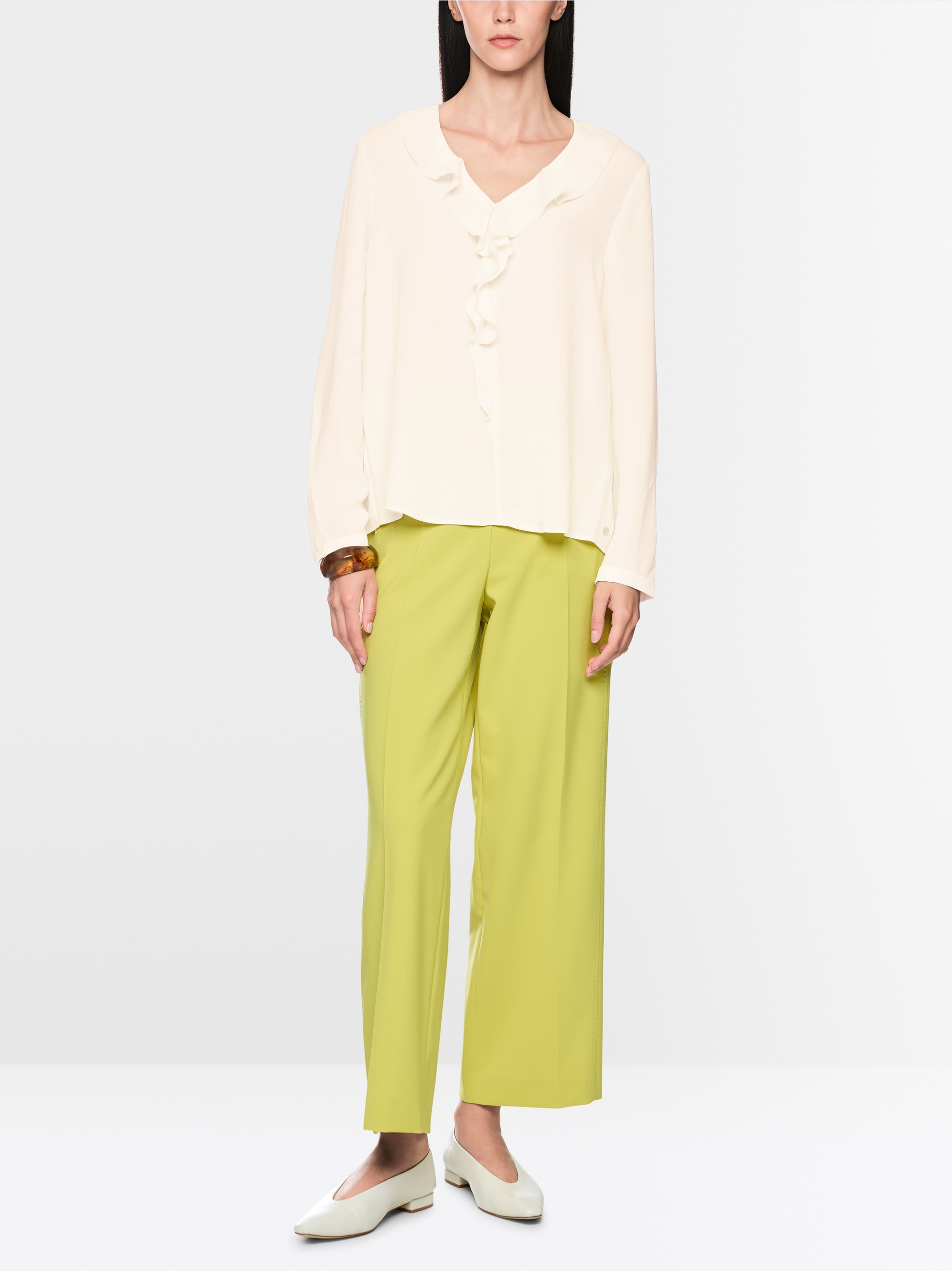Blouse with flounces