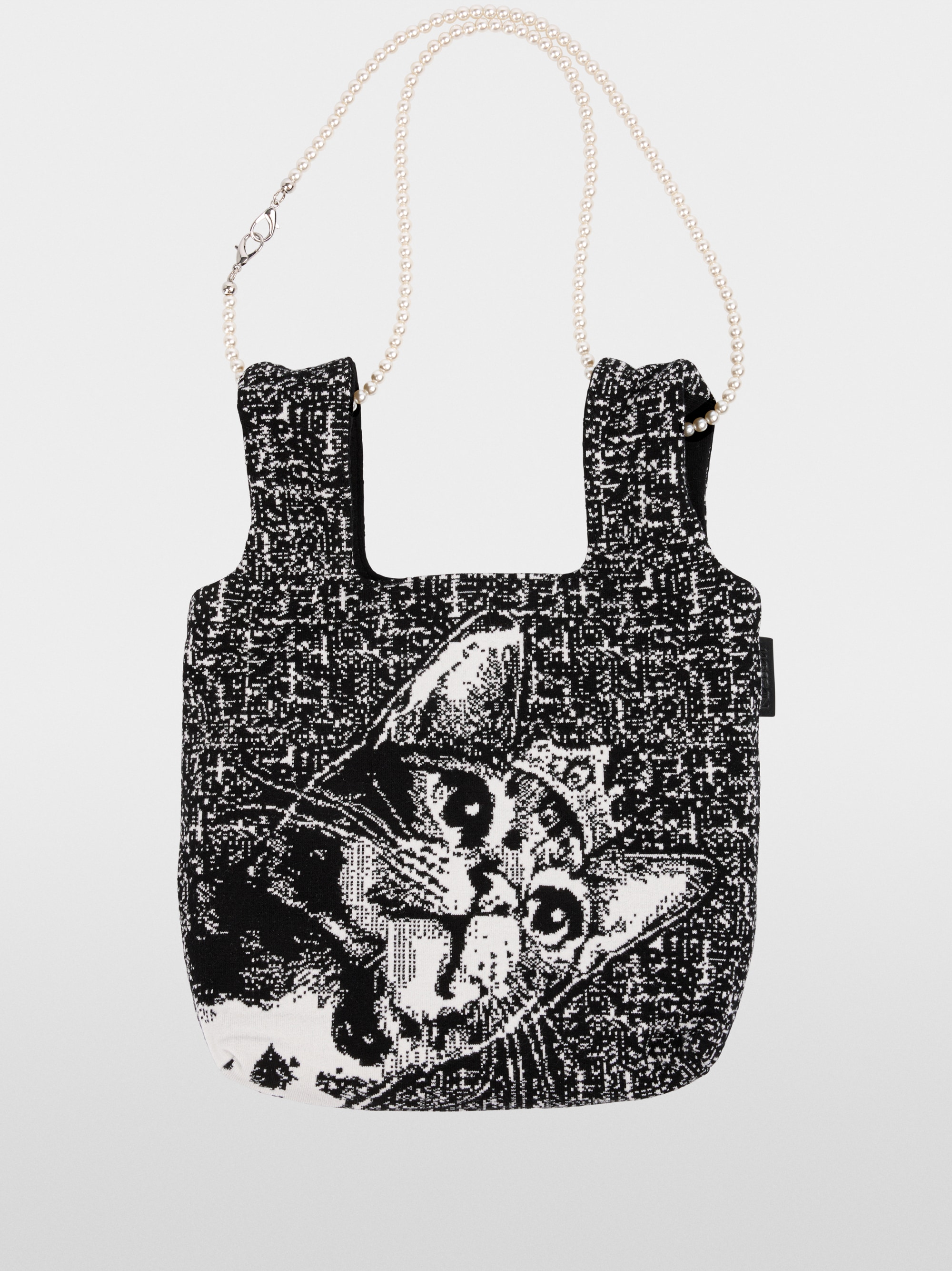 Reversible knitted bag with cat motif