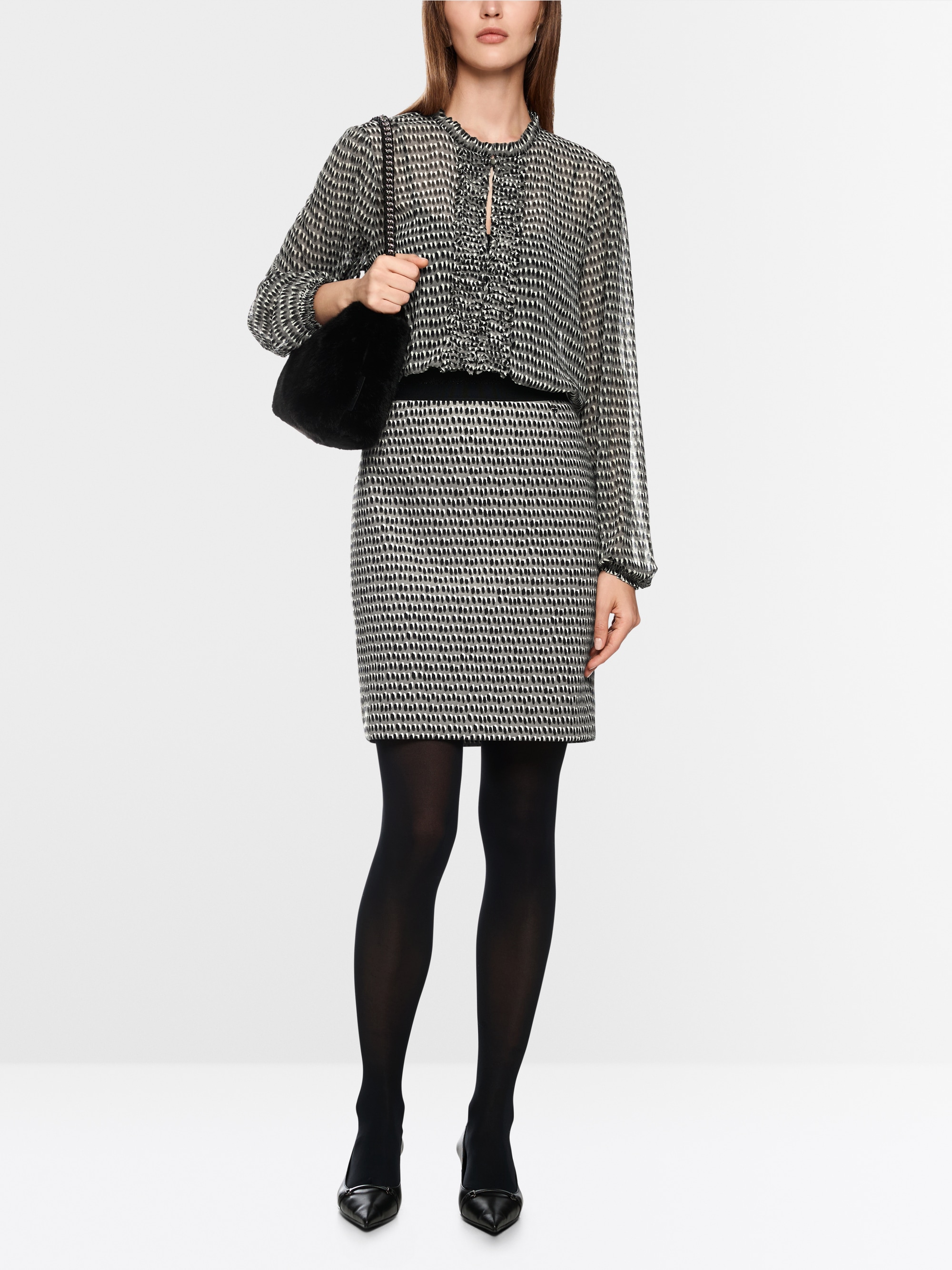 Semi-transparent blouse with ruffles