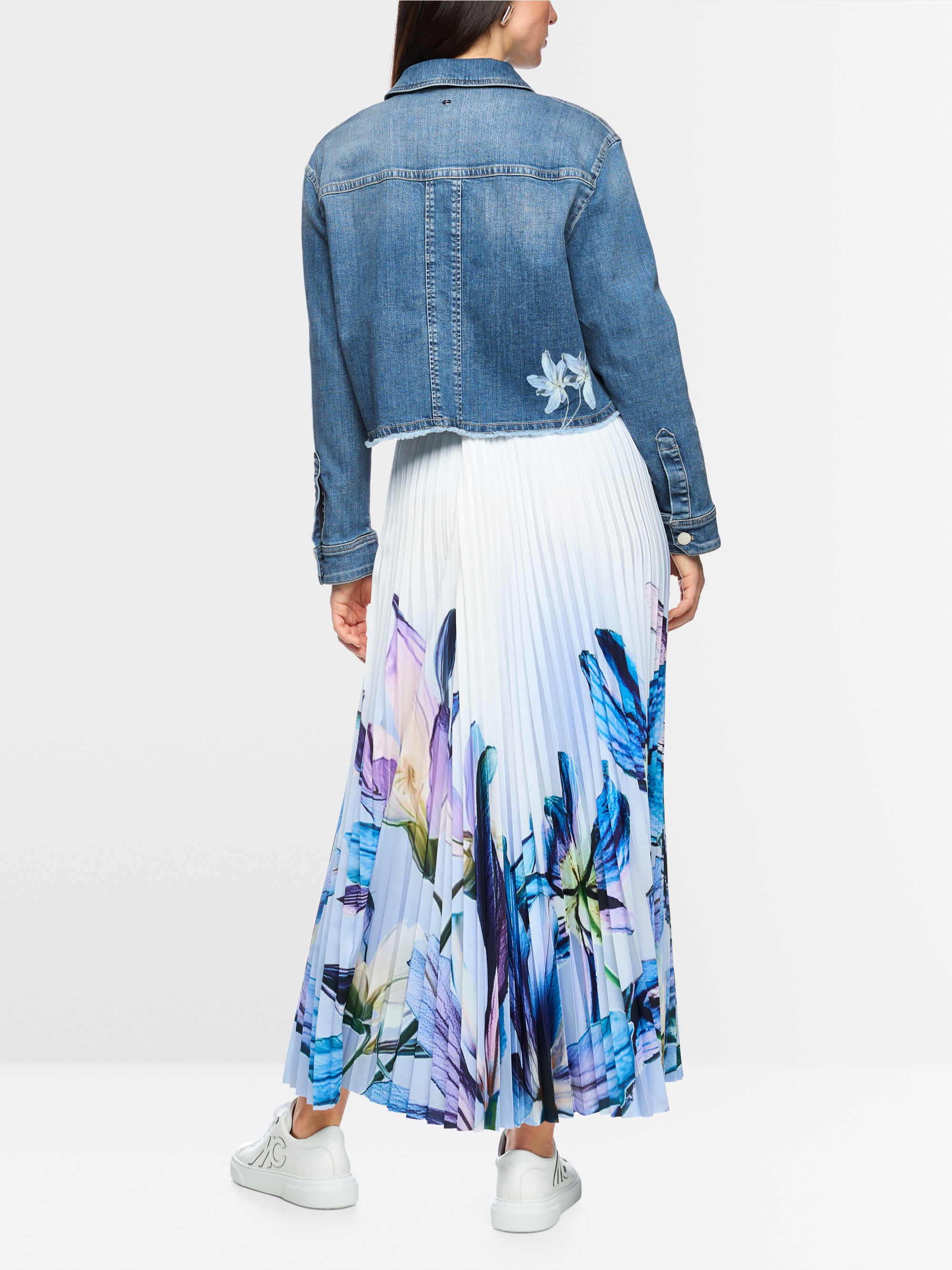 Denim jacket with floral print sleeves