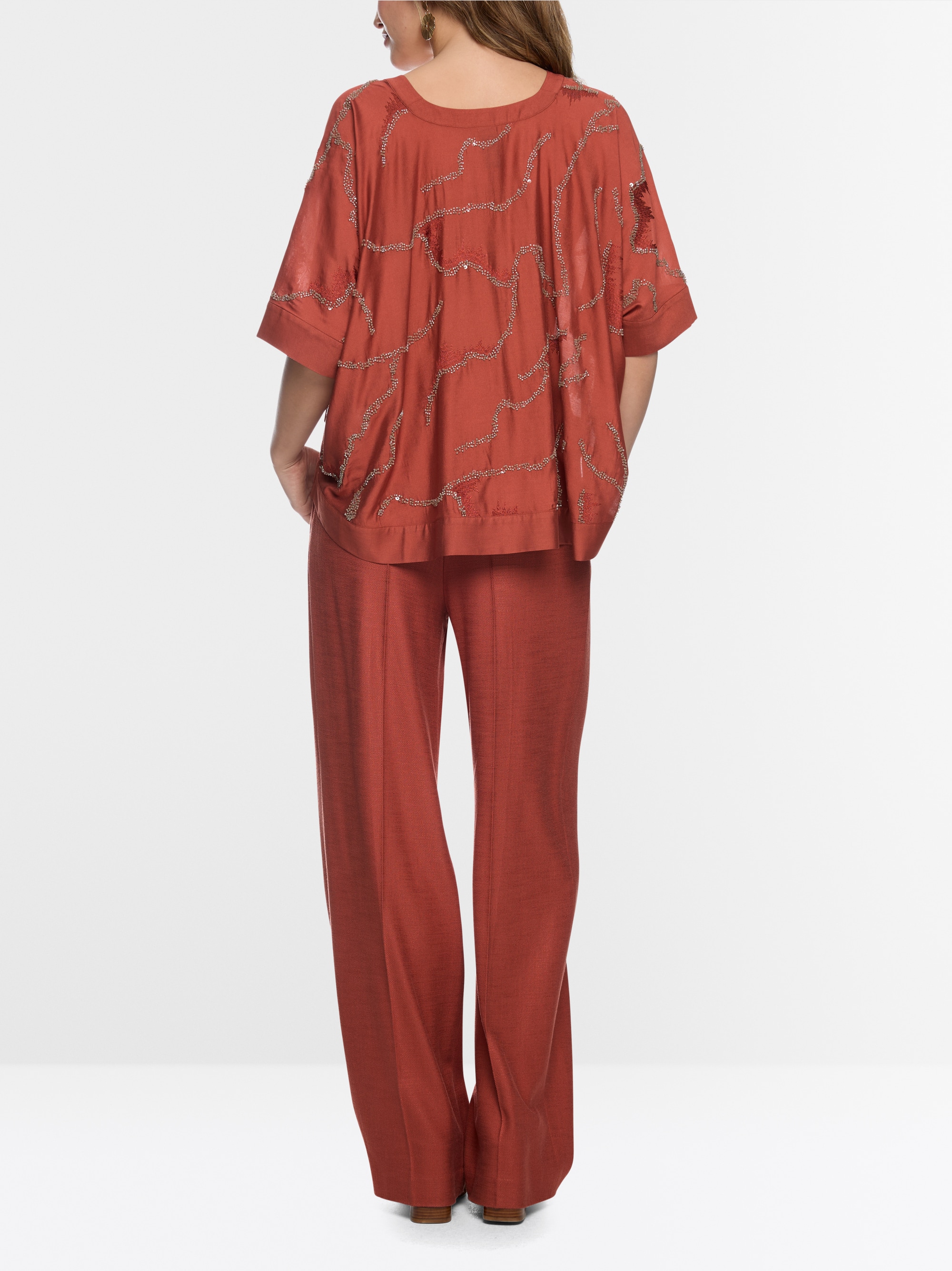 Flared blouse with embellishment