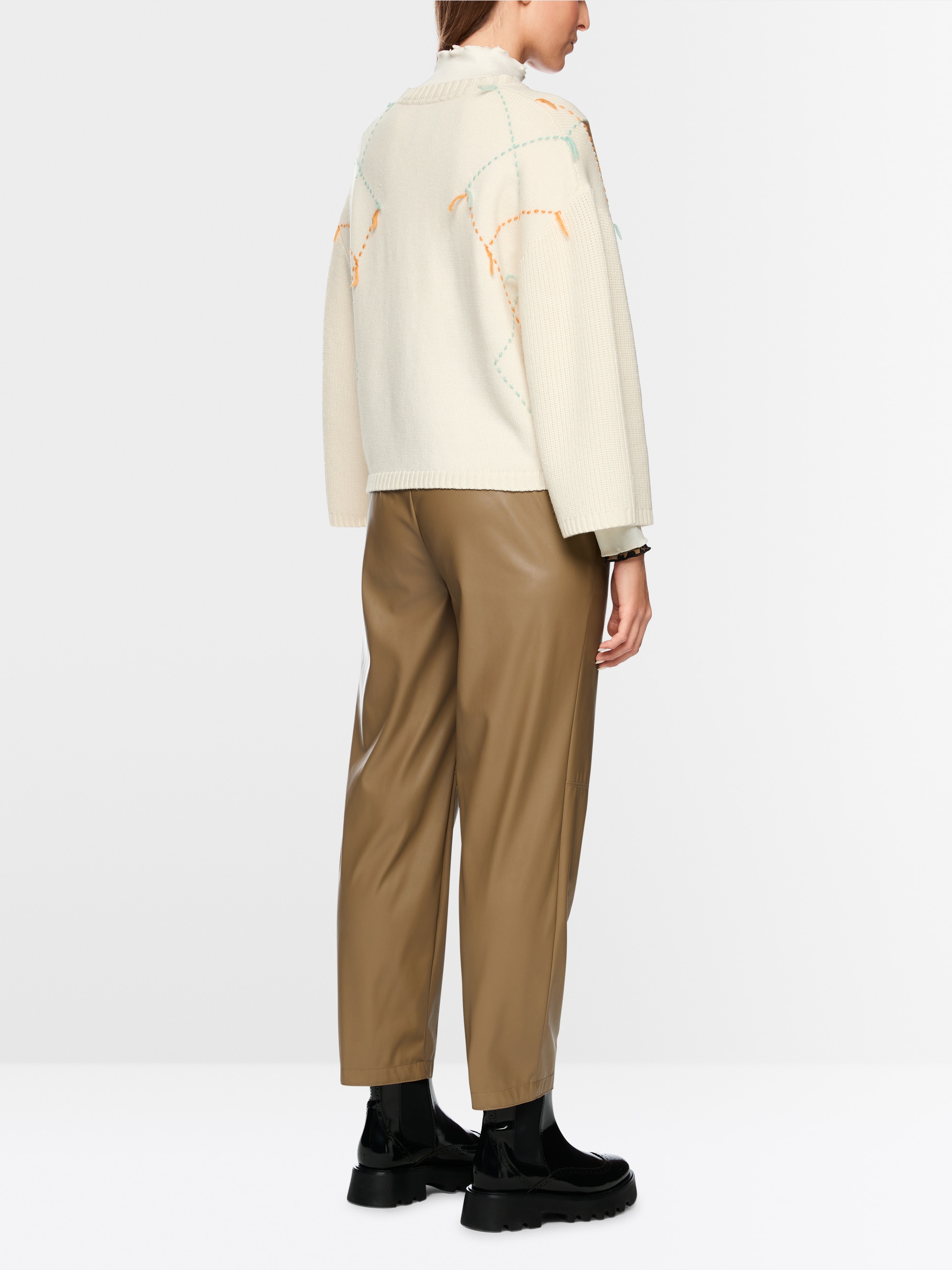 Wool jumper with argyle and fringes