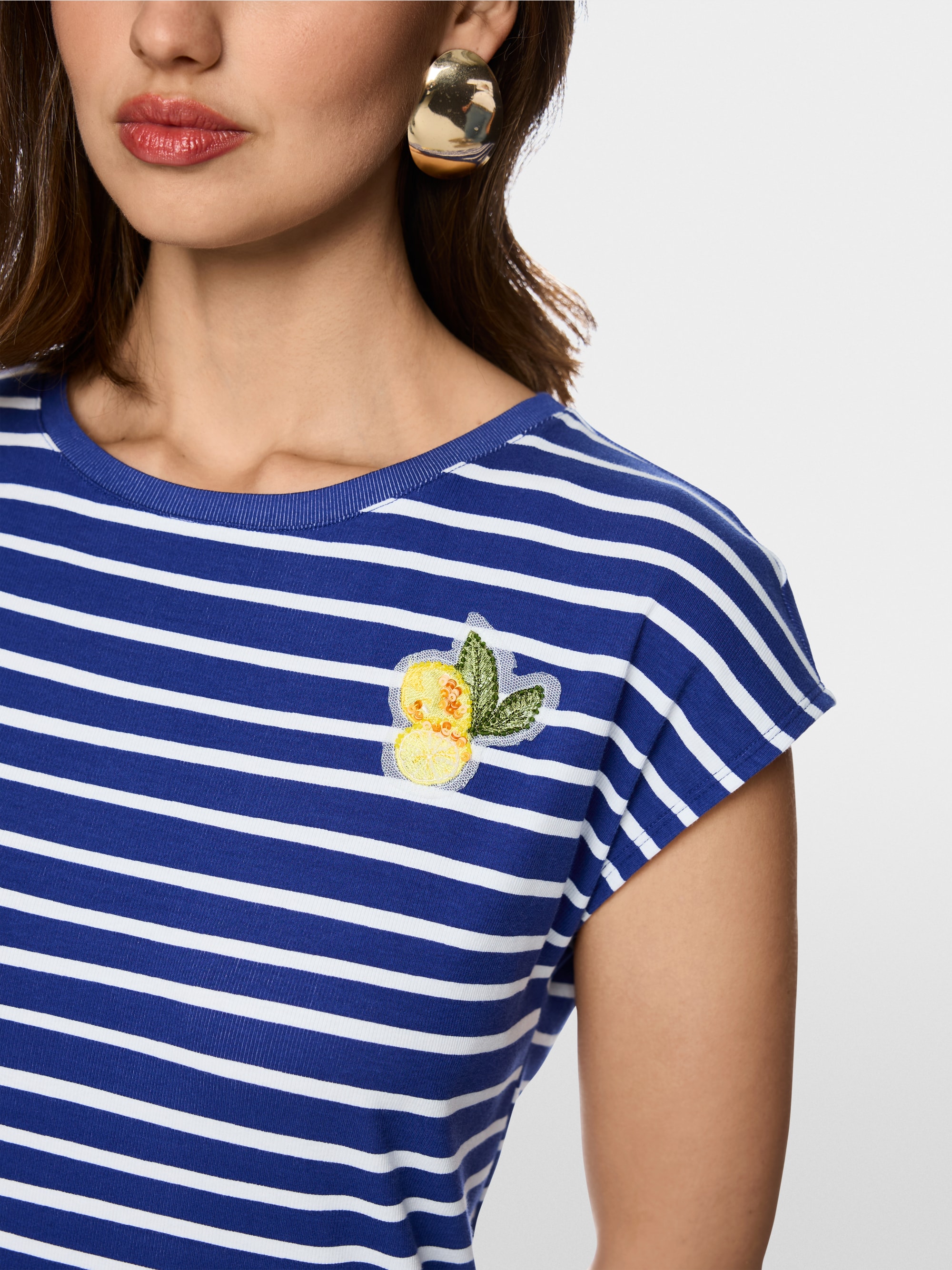 Striped shirt with lemon appliqué