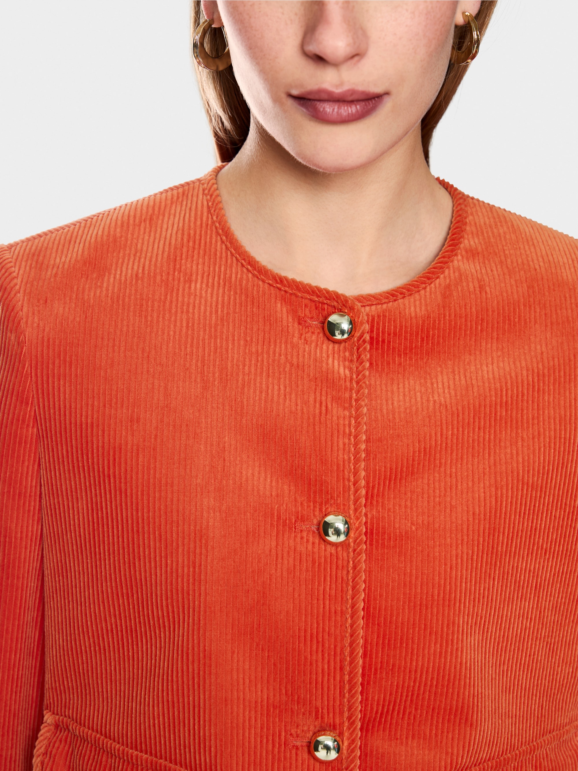 Short jacket with decorative buttons
