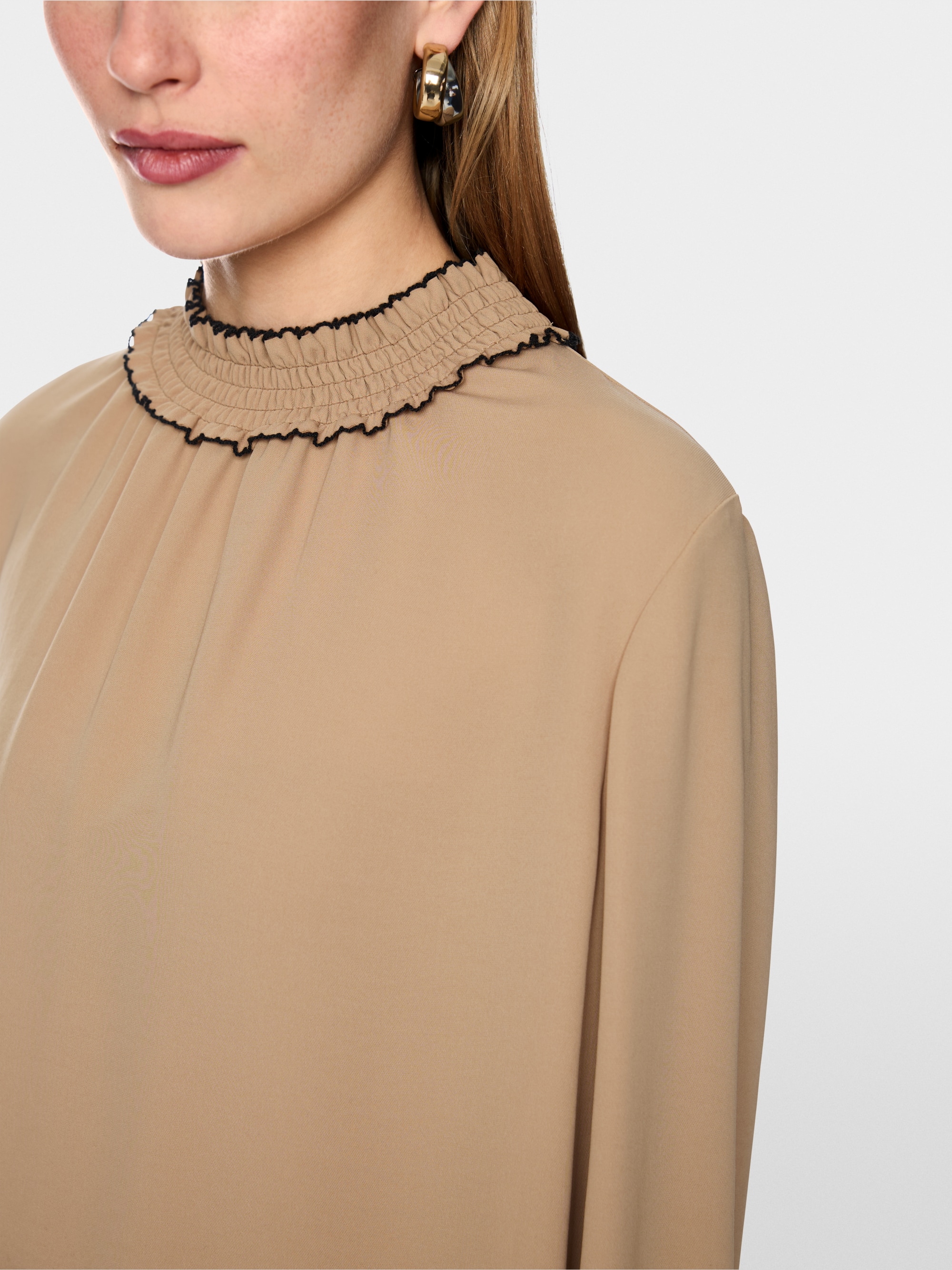 Loose-fitting blouse with smocking