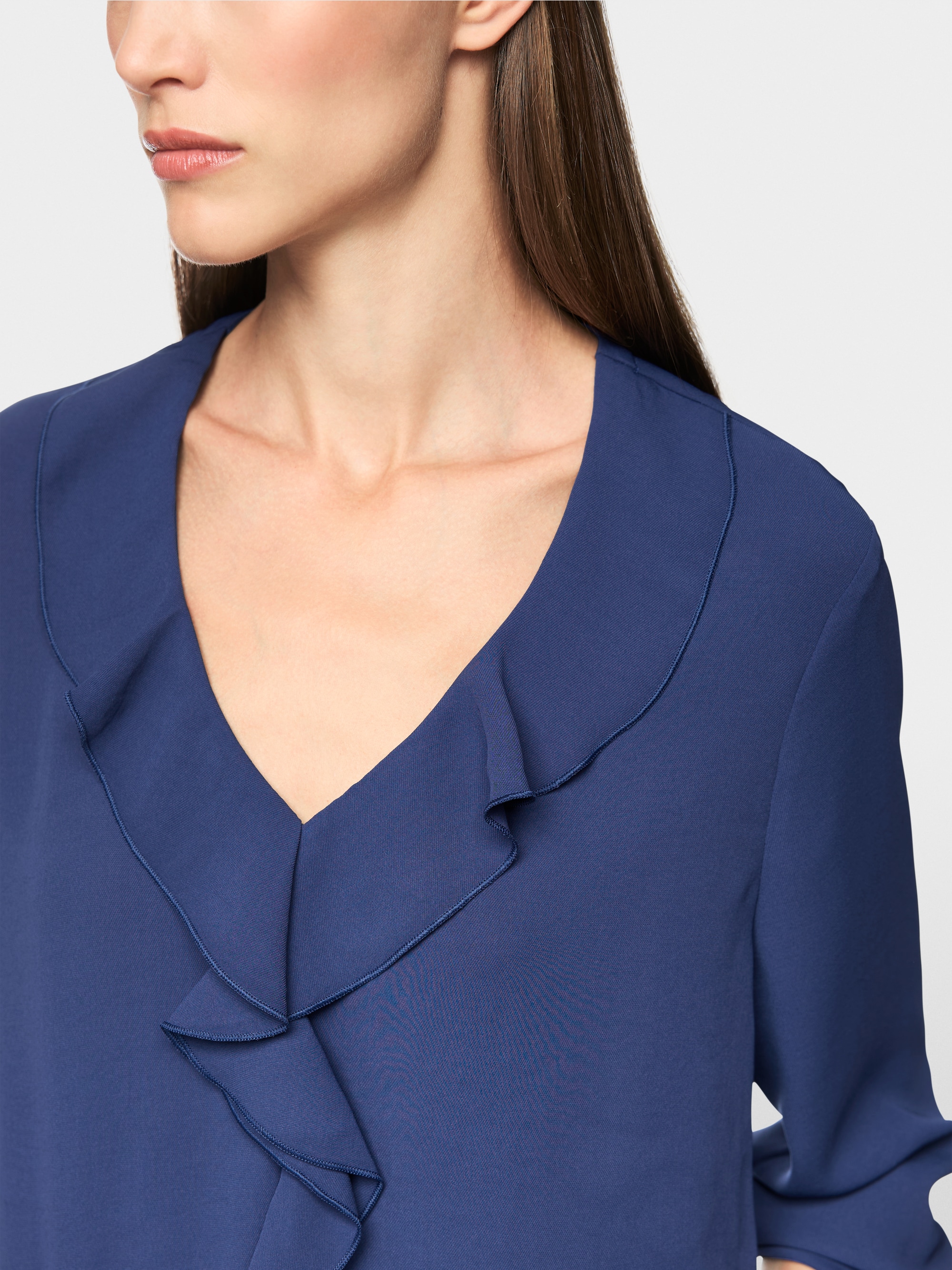 Blouse with flounces