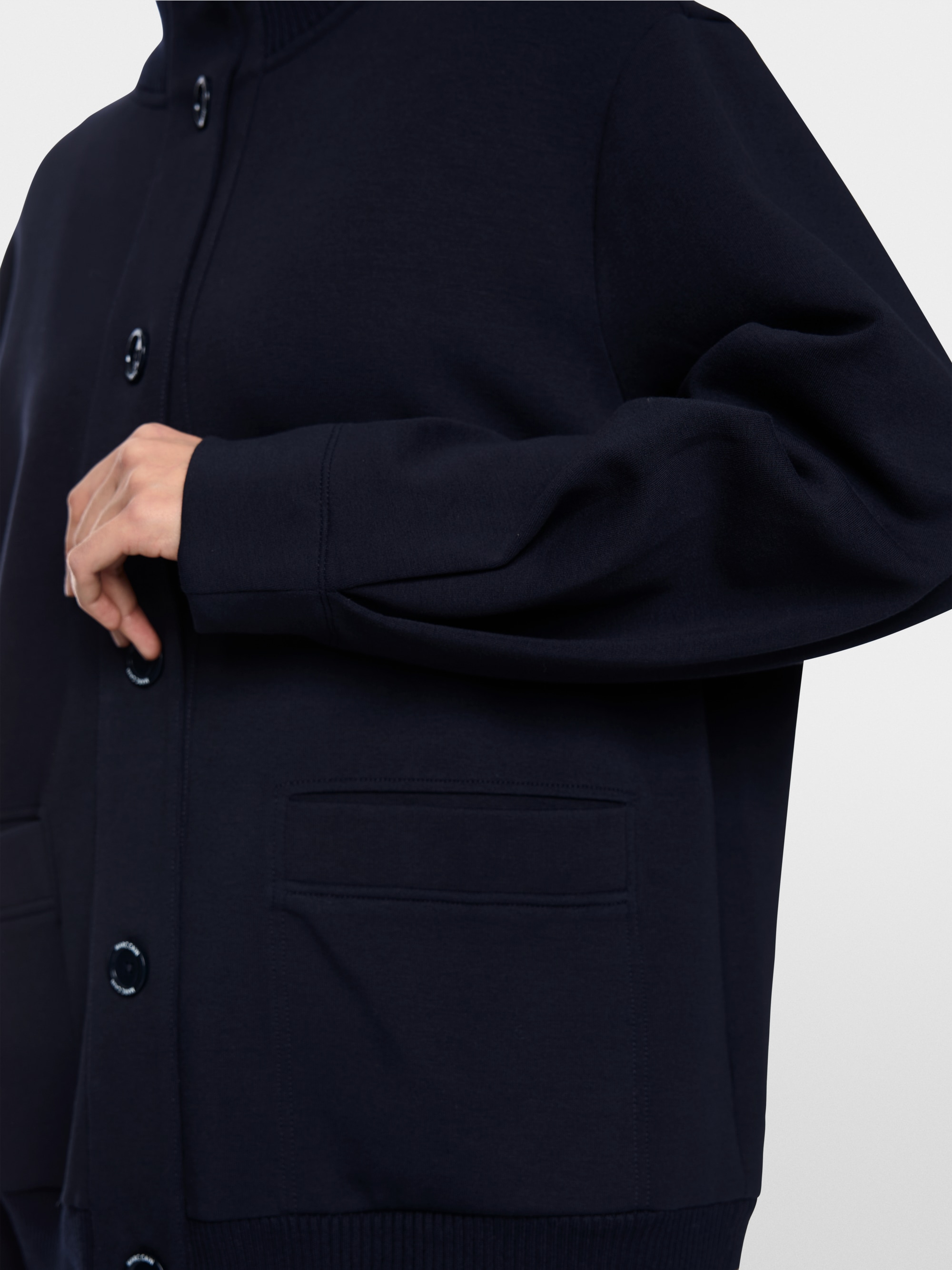 Jacket with knitted details