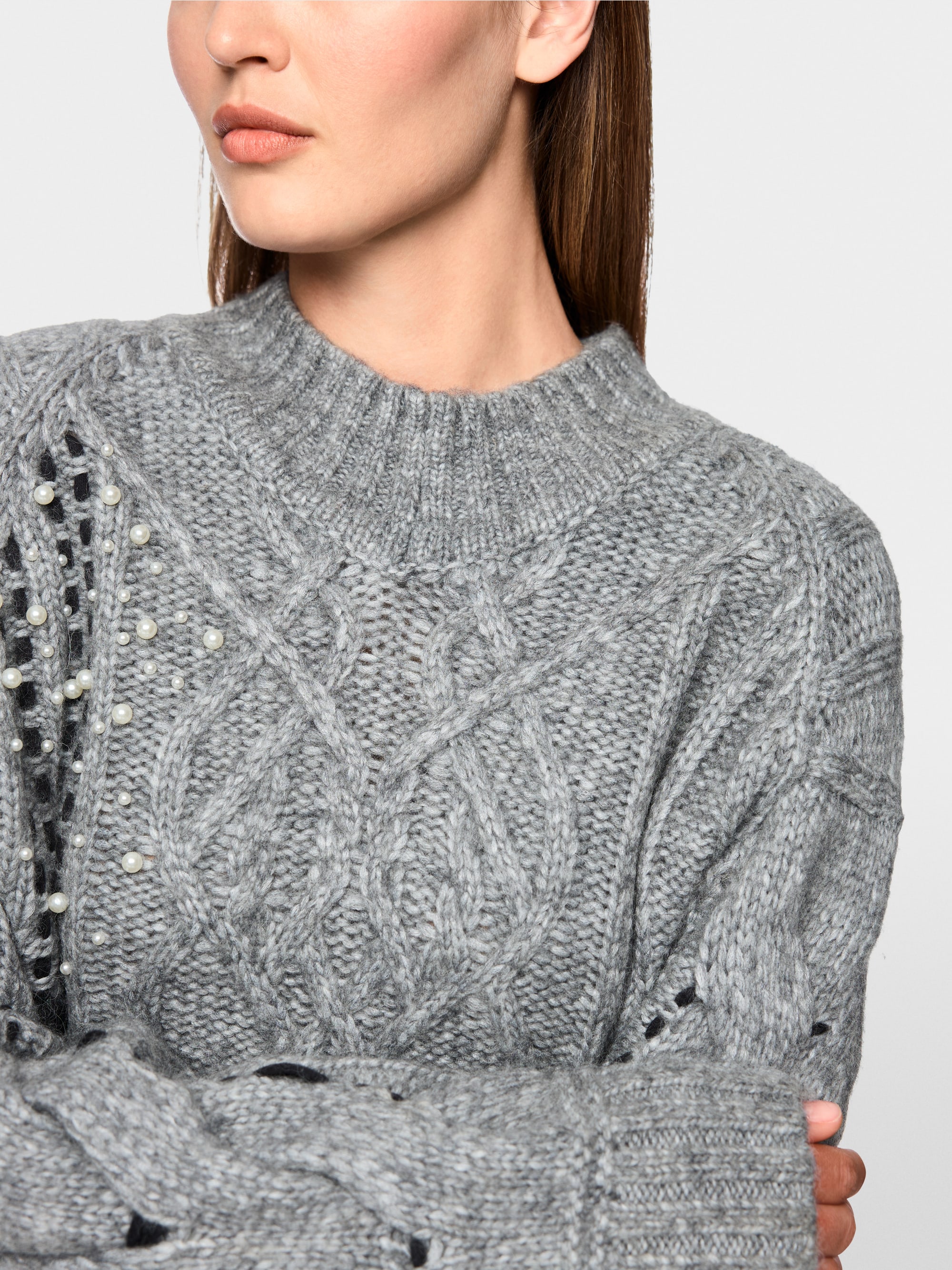 Cable-knit jumper with details