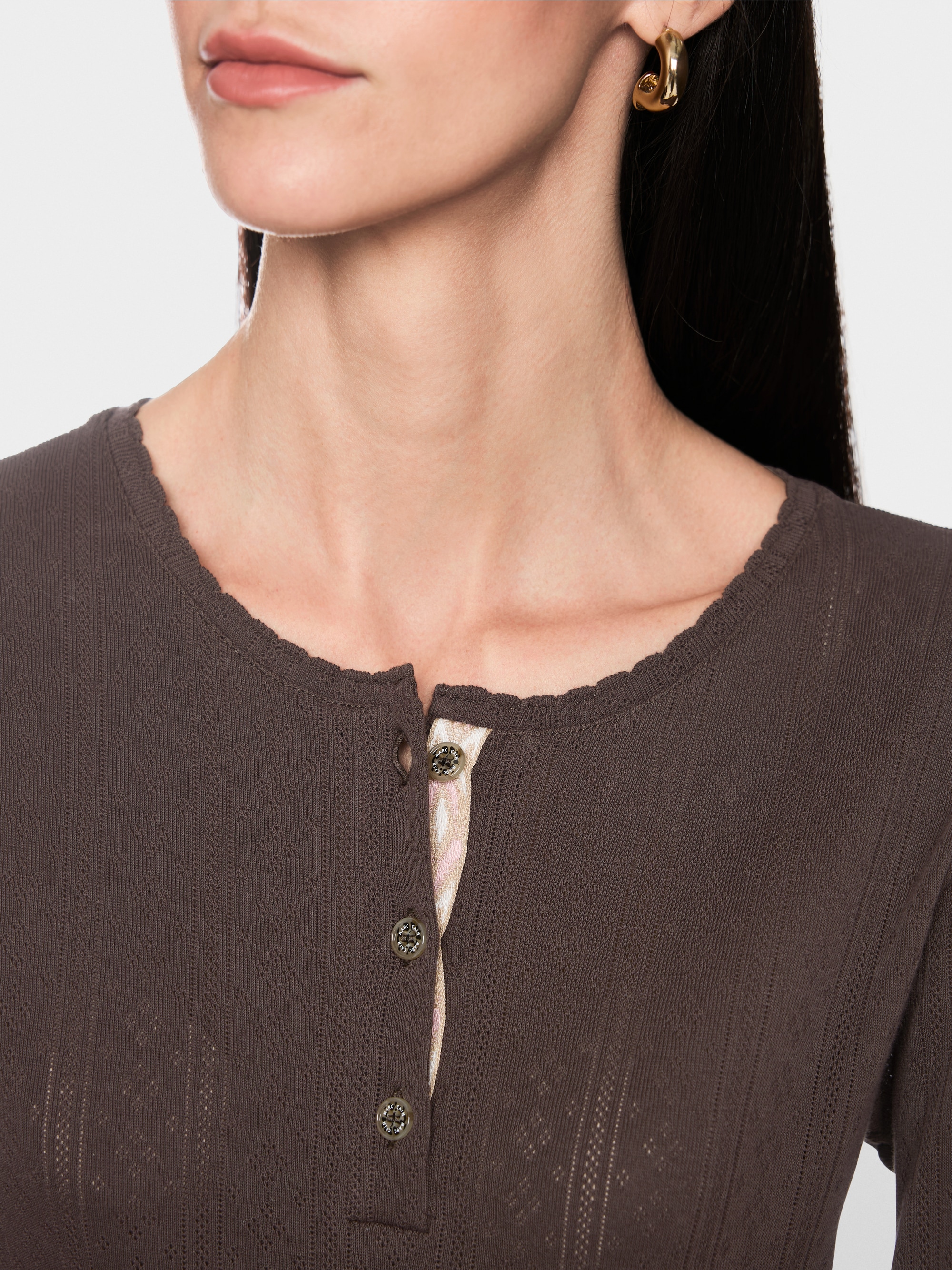 Long-sleeved buttoned openwork top
