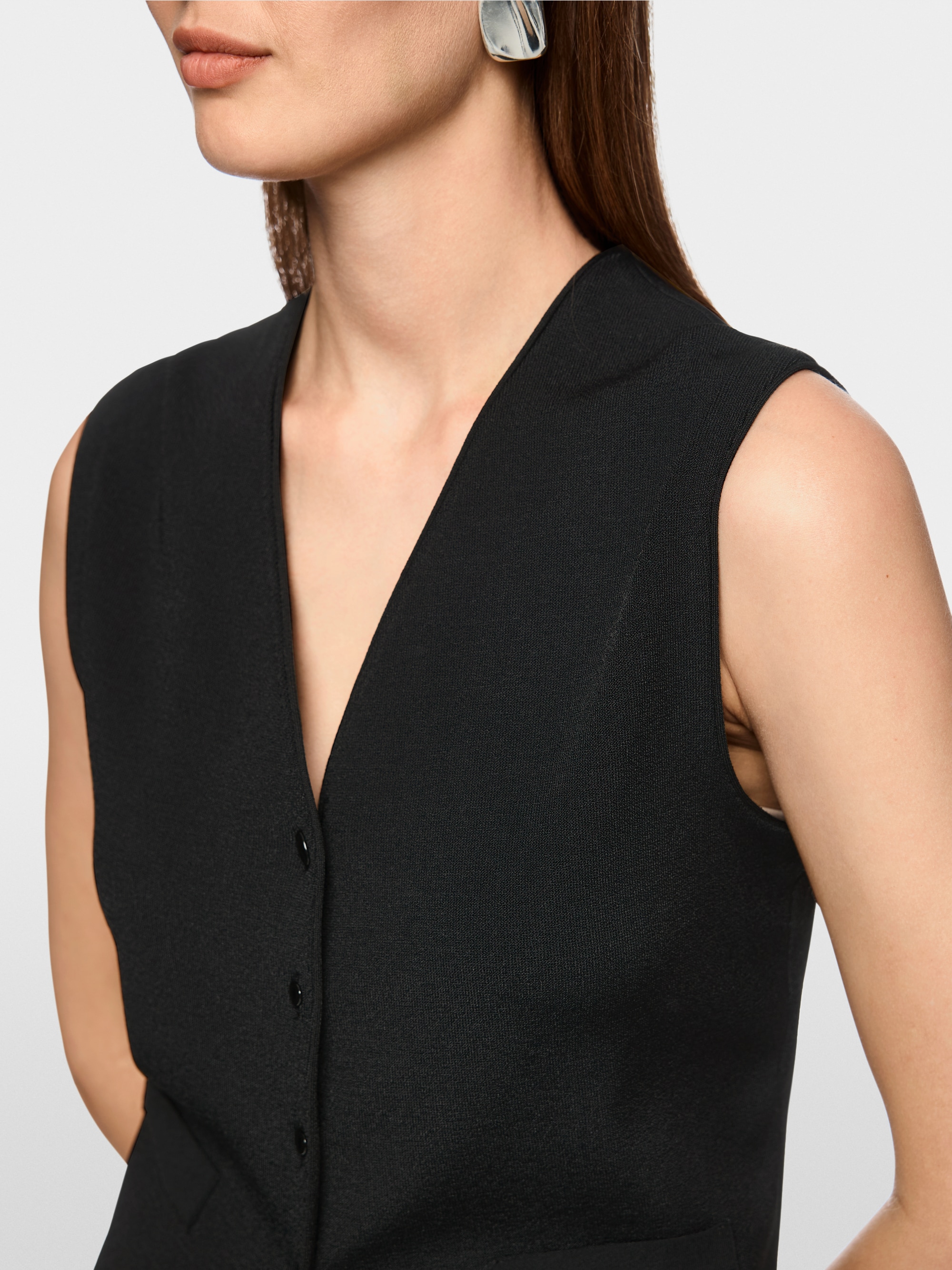 Getailleerd gebreid vest “Rethink Together”