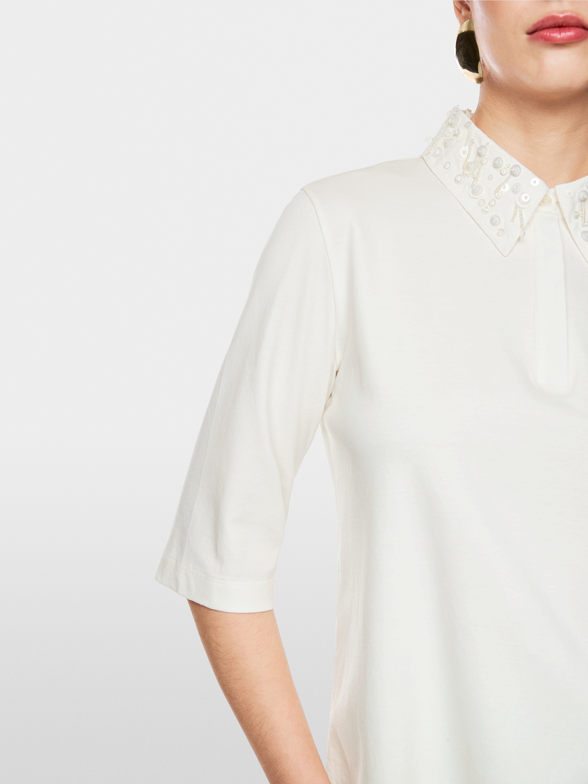 Poloshirt met sierkralen