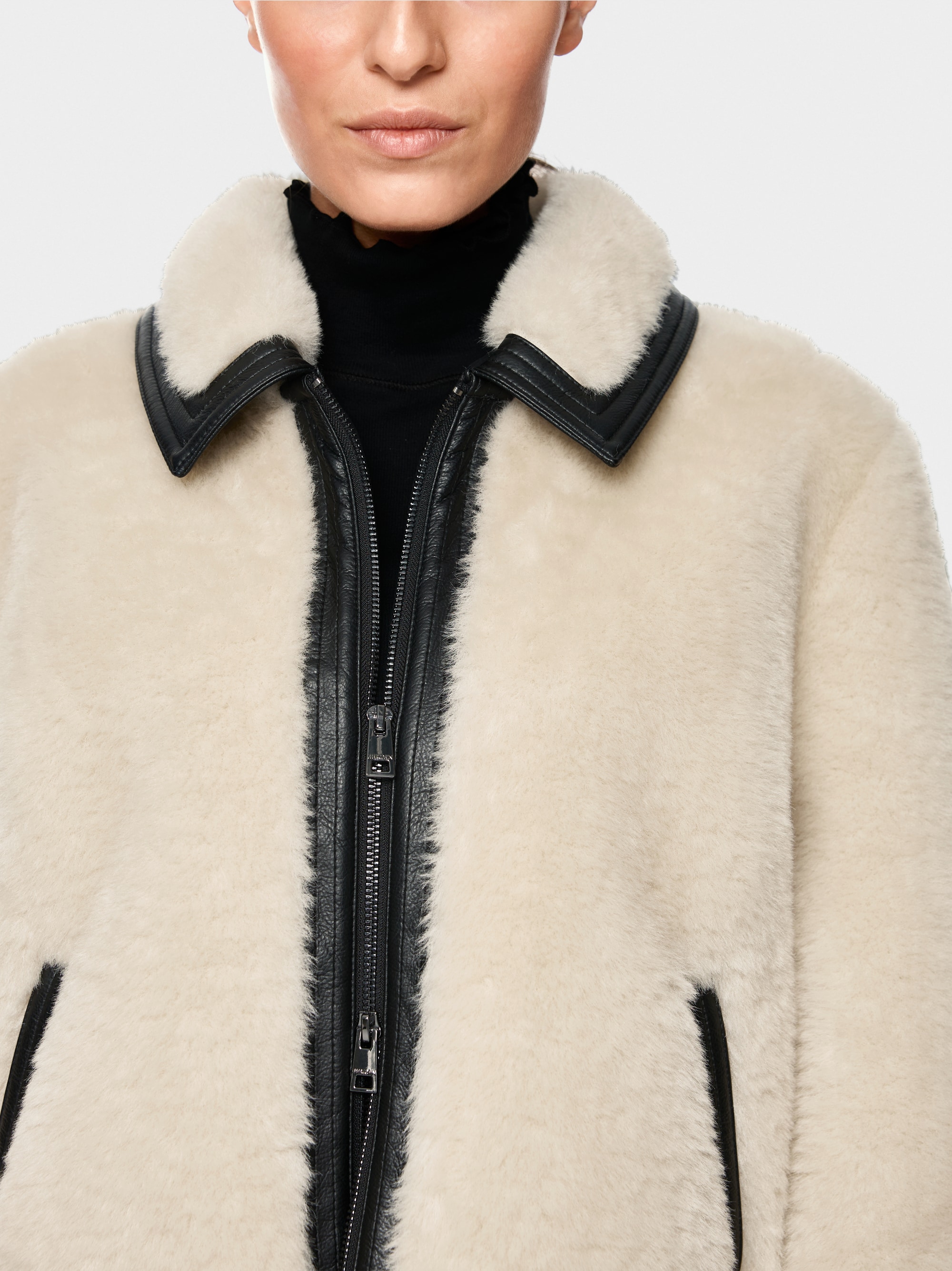 Faux fur jacket with strap detail