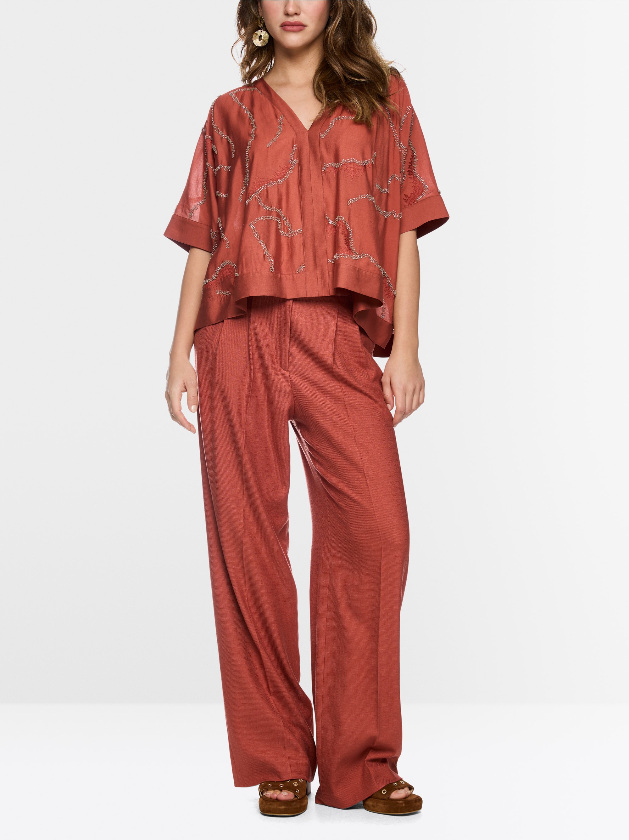 Flared blouse with embellishment