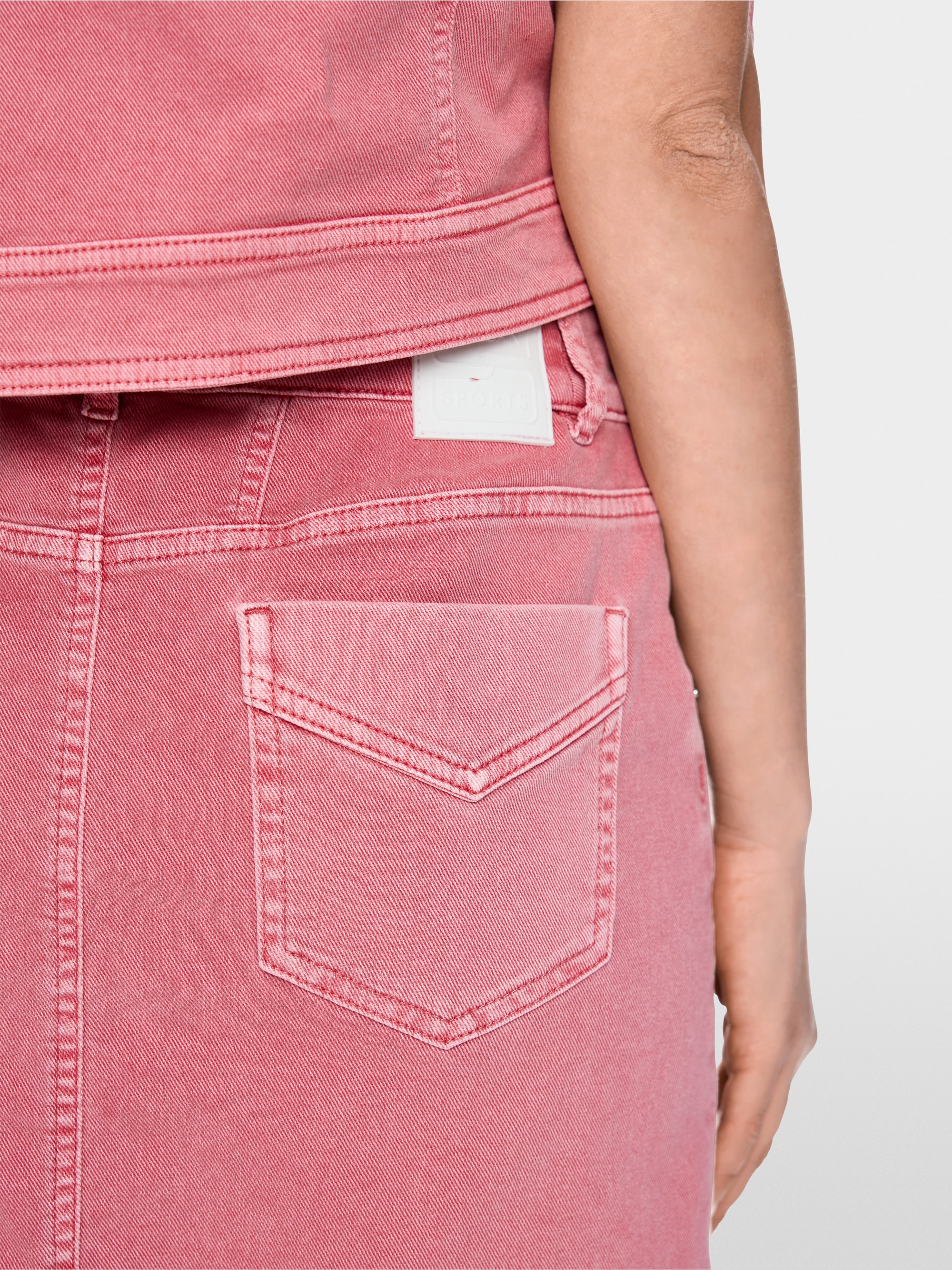 Mini denim skirt with open hem