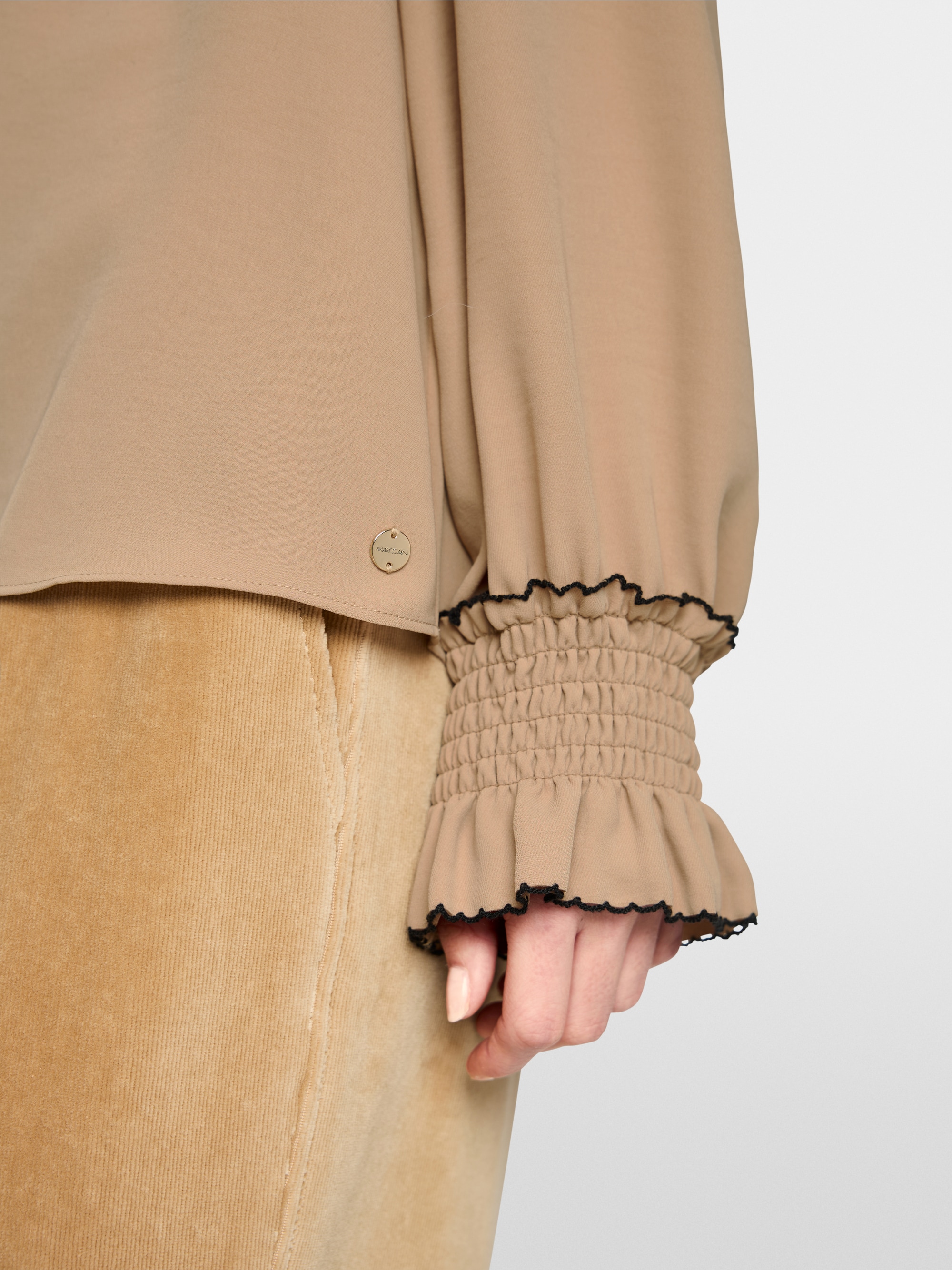 Loose-fitting blouse with smocking