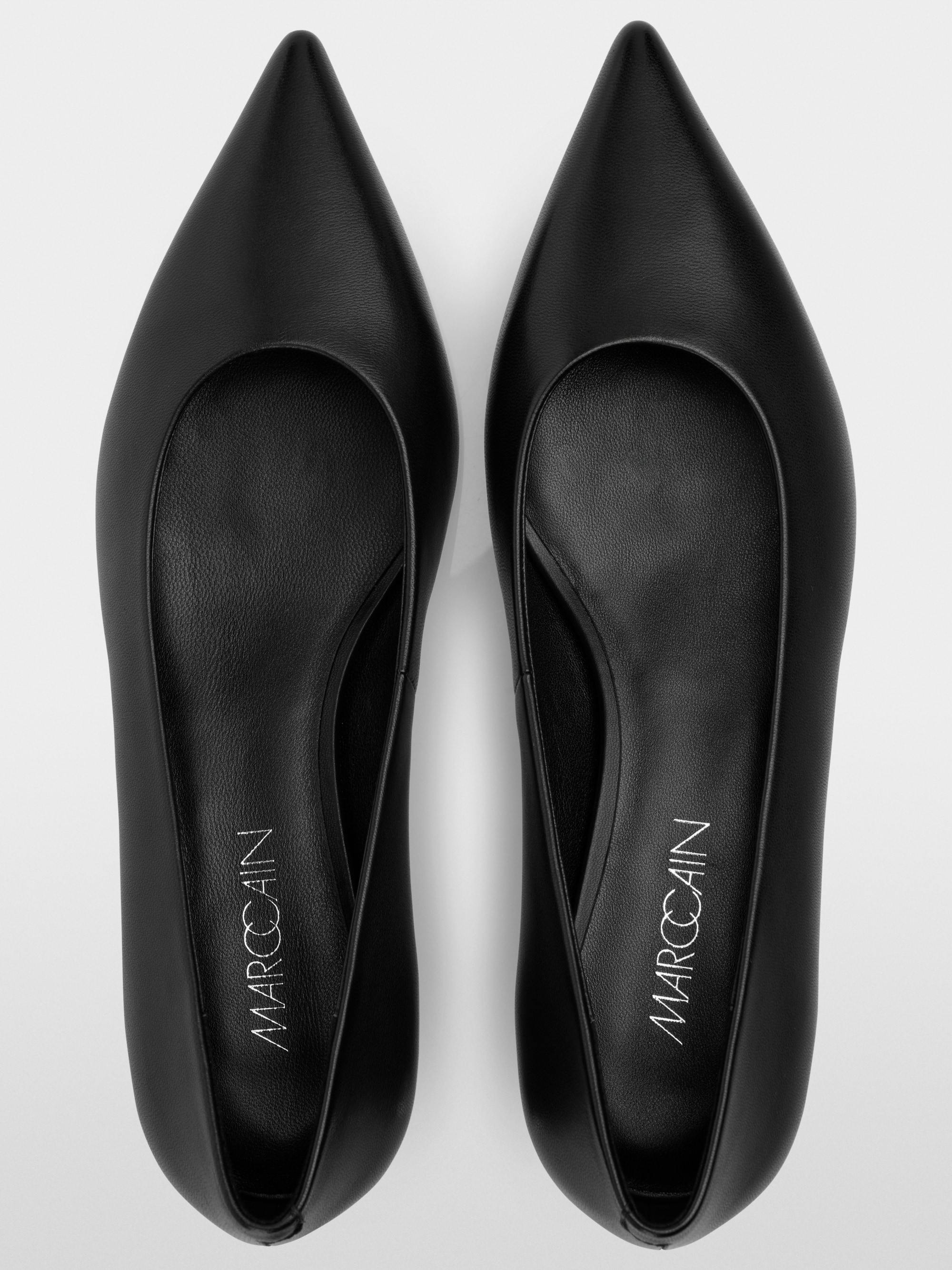 Pumps with metallic heel