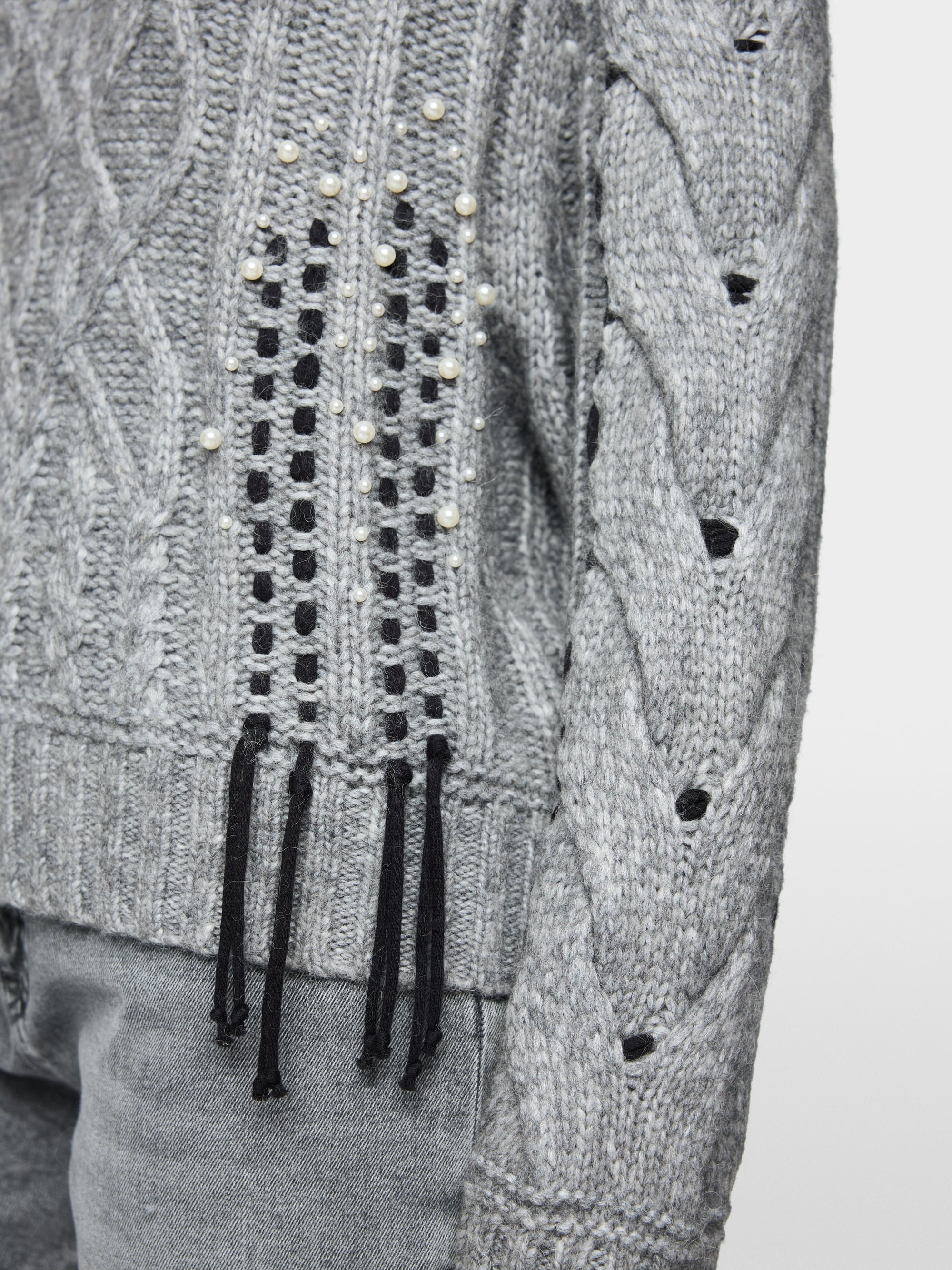 Cable-knit jumper with details