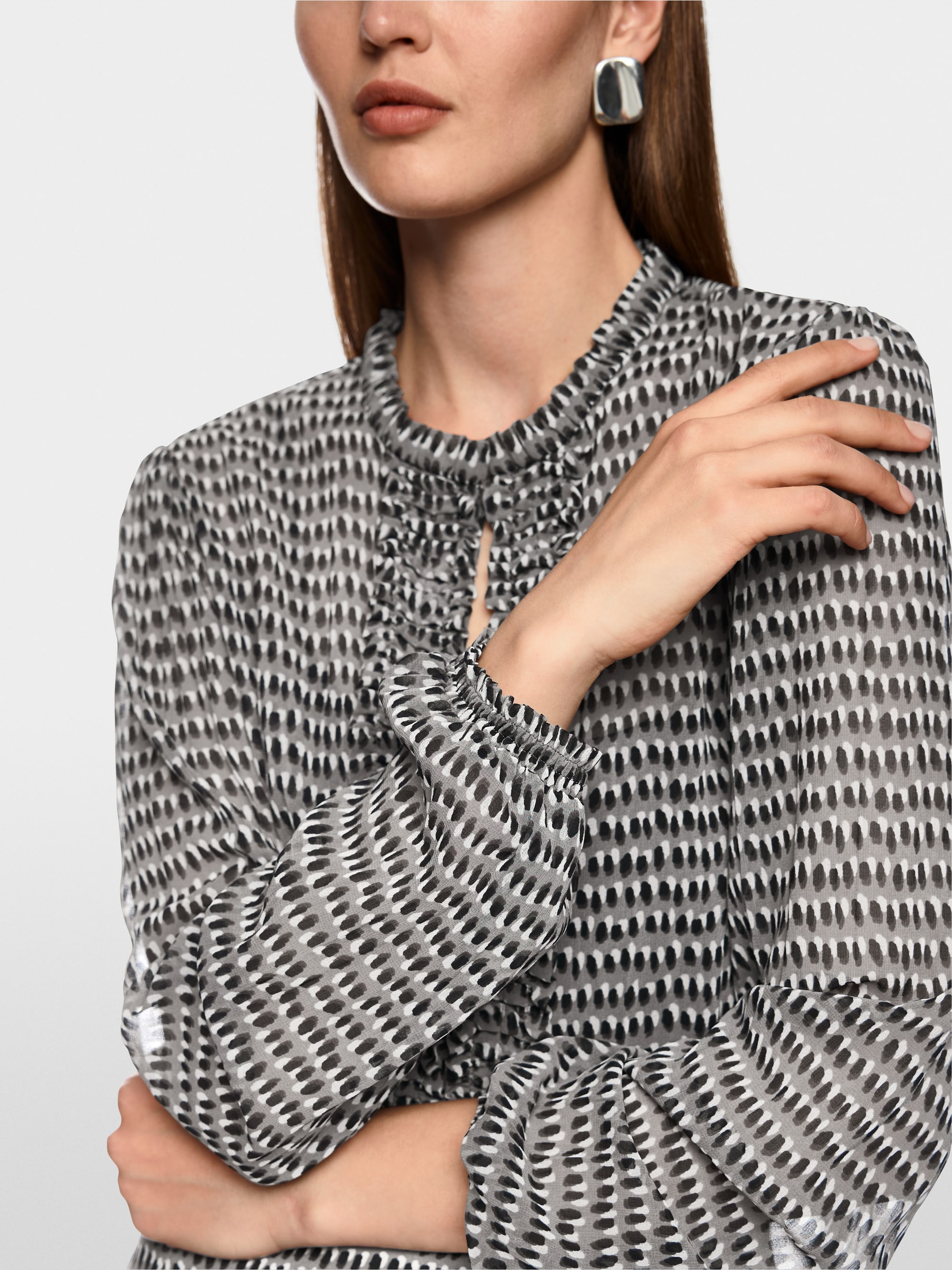 Semi-transparent blouse with ruffles