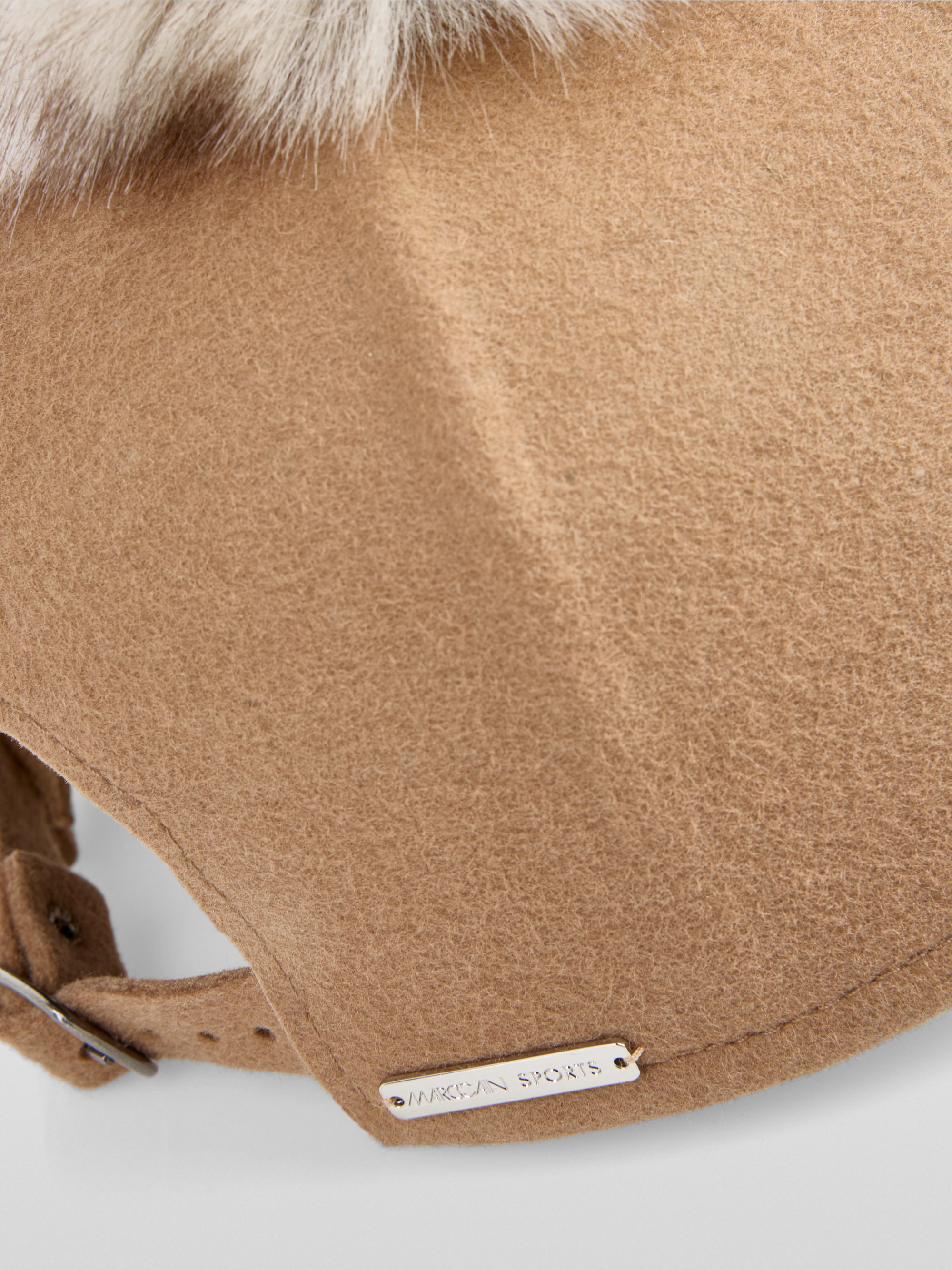 Wool cap with faux fur pompom