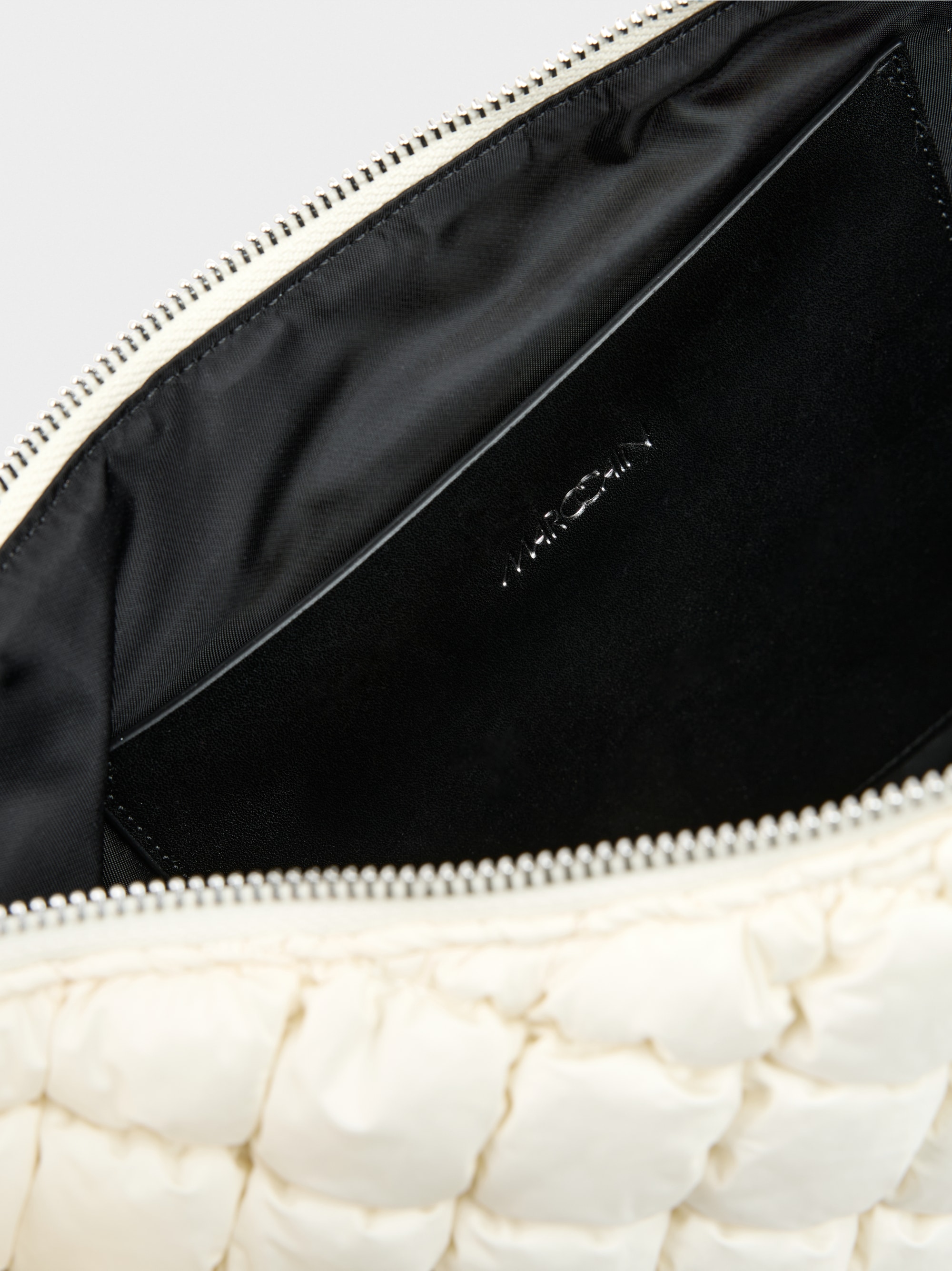 Half-moon quilted design shoulder bag
