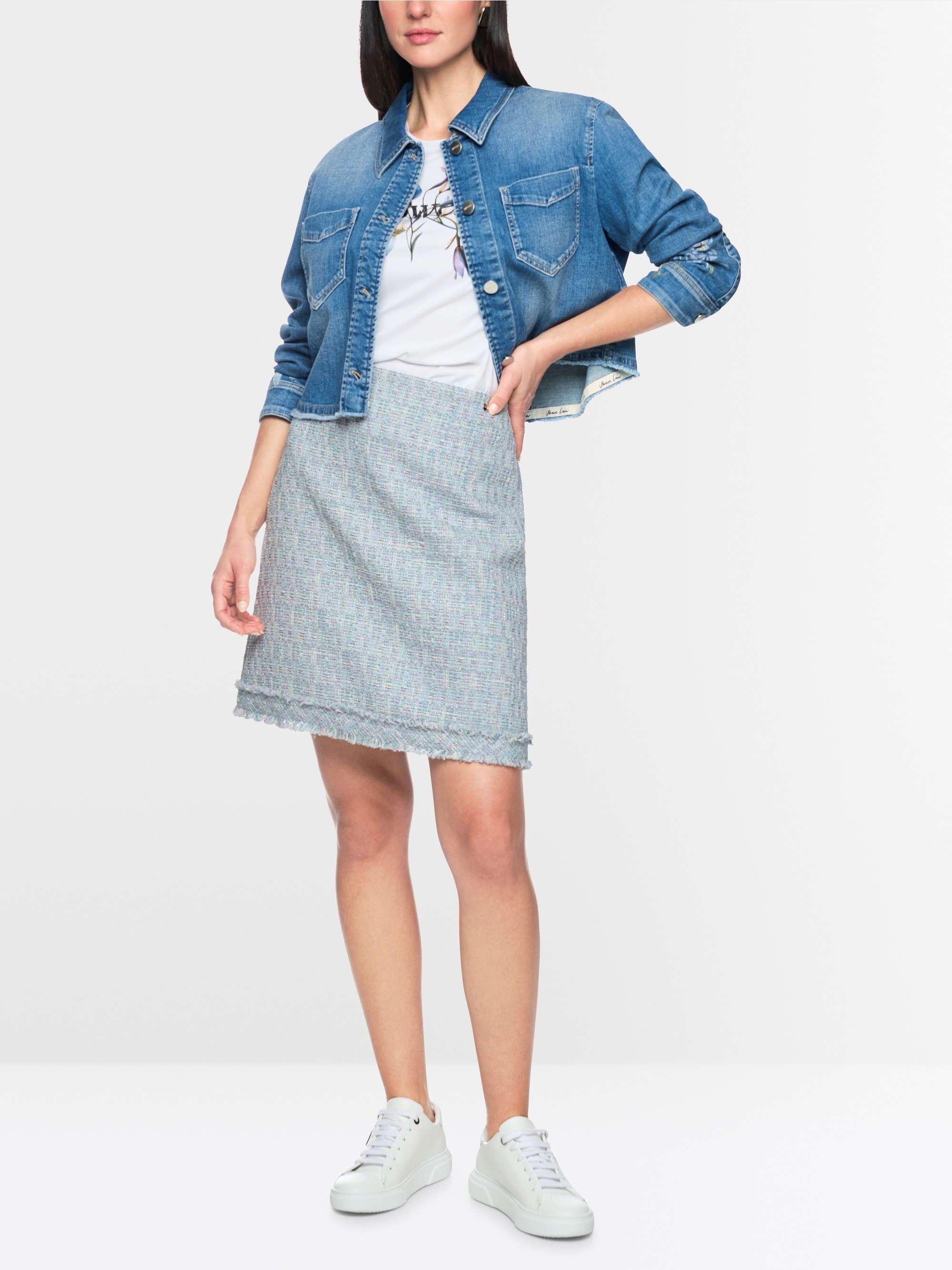 Mini-jupe en bouclé à franges