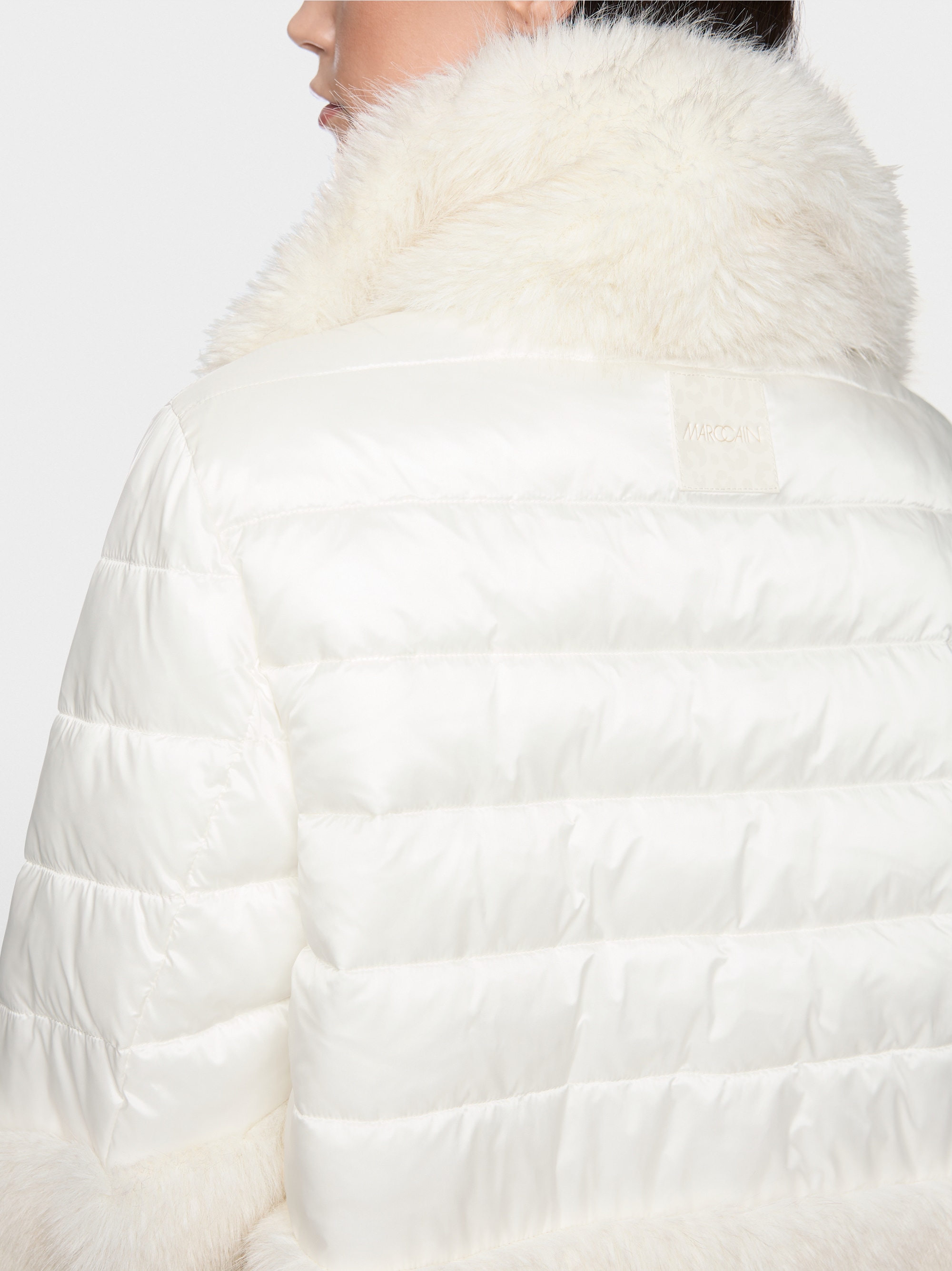 Quilted jacket with faux fur