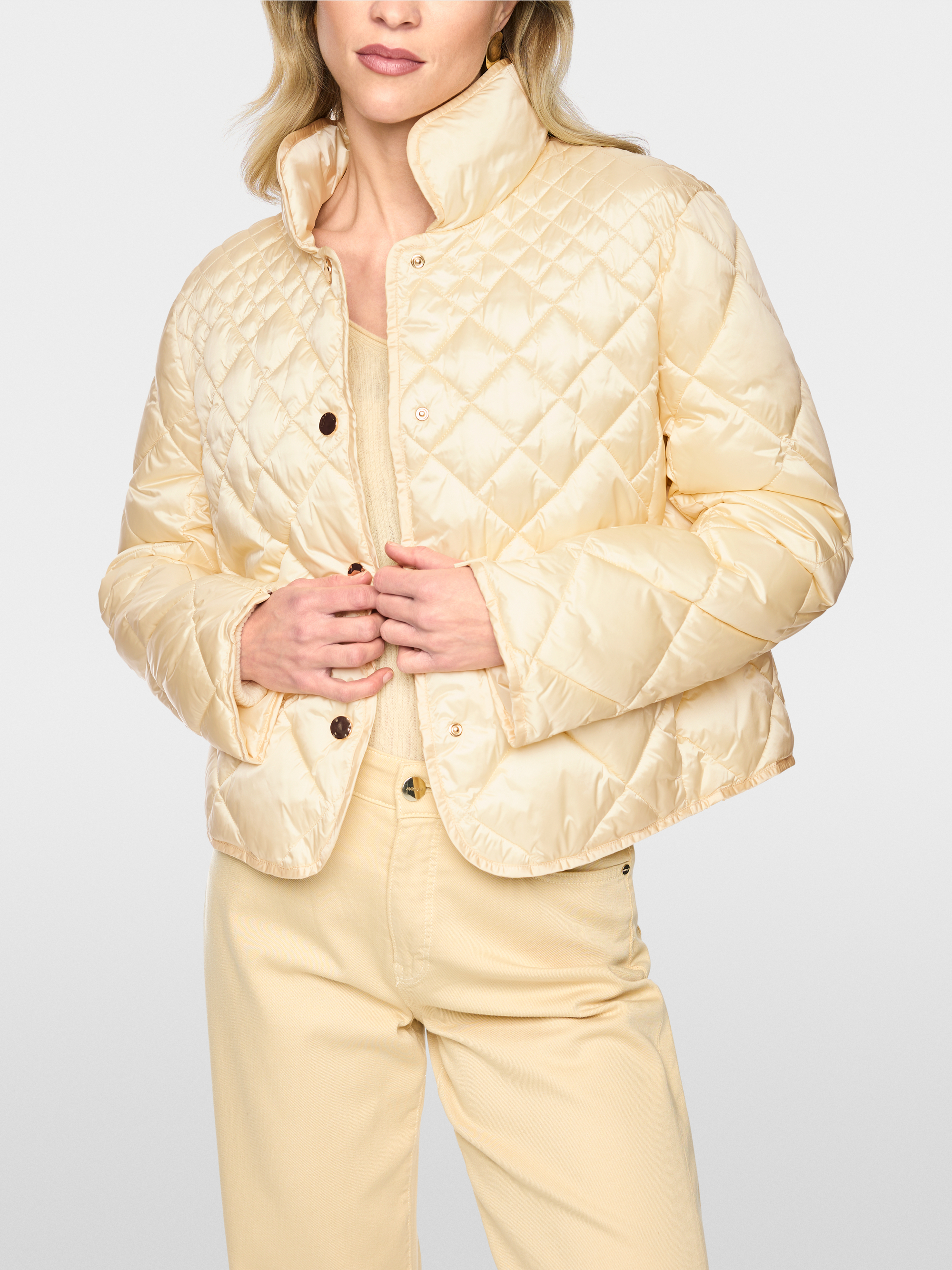 Quilted jacket with decorative buttons