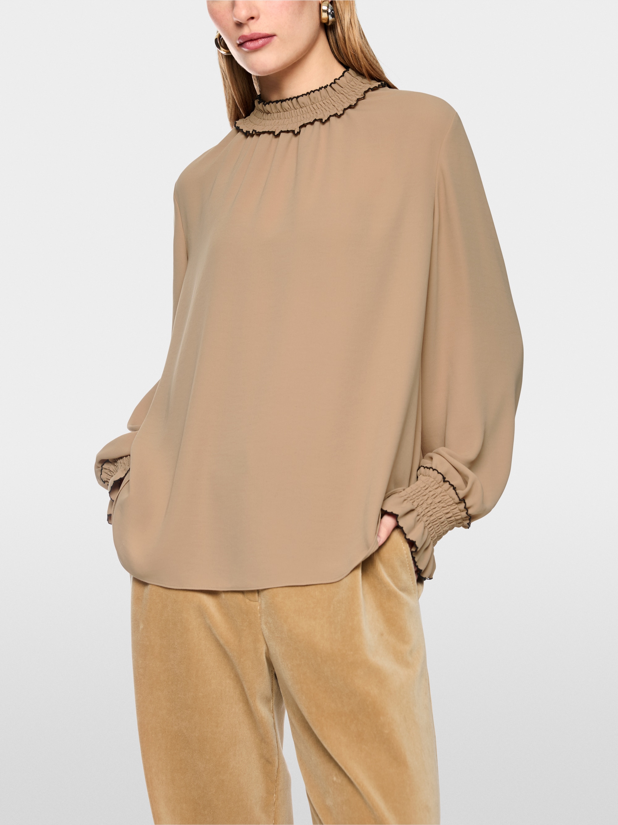 Loose-fitting blouse with smocking