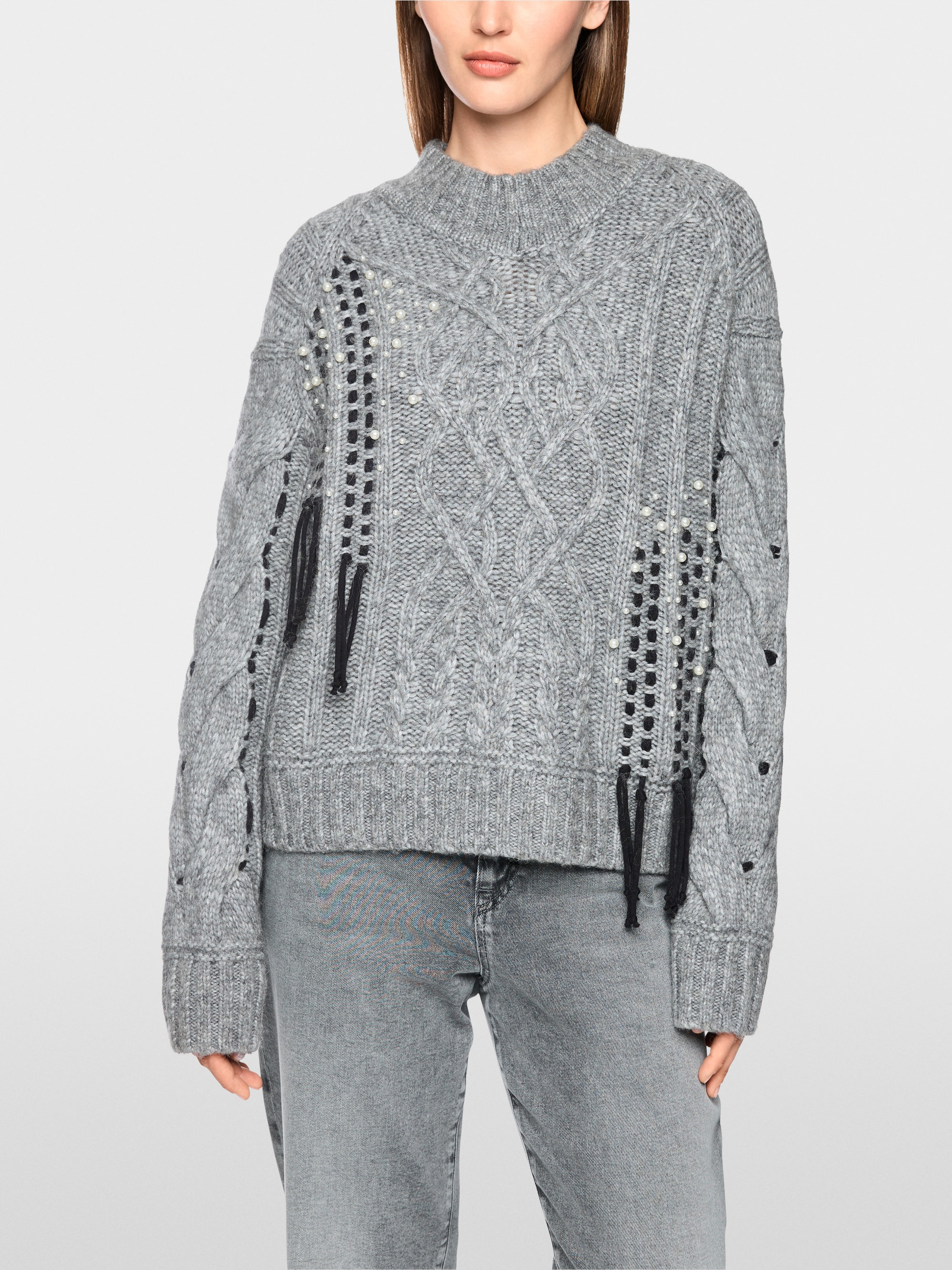 Cable-knit jumper with details