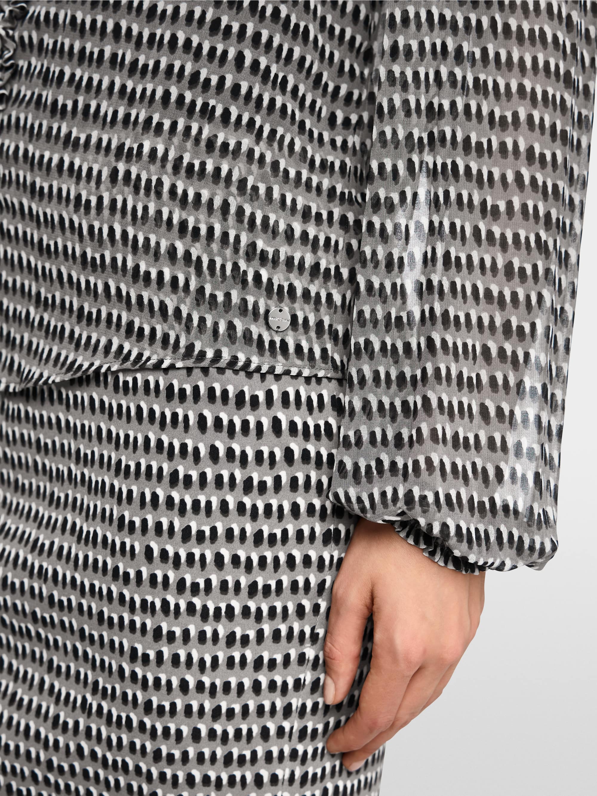 Semi-transparent blouse with ruffles