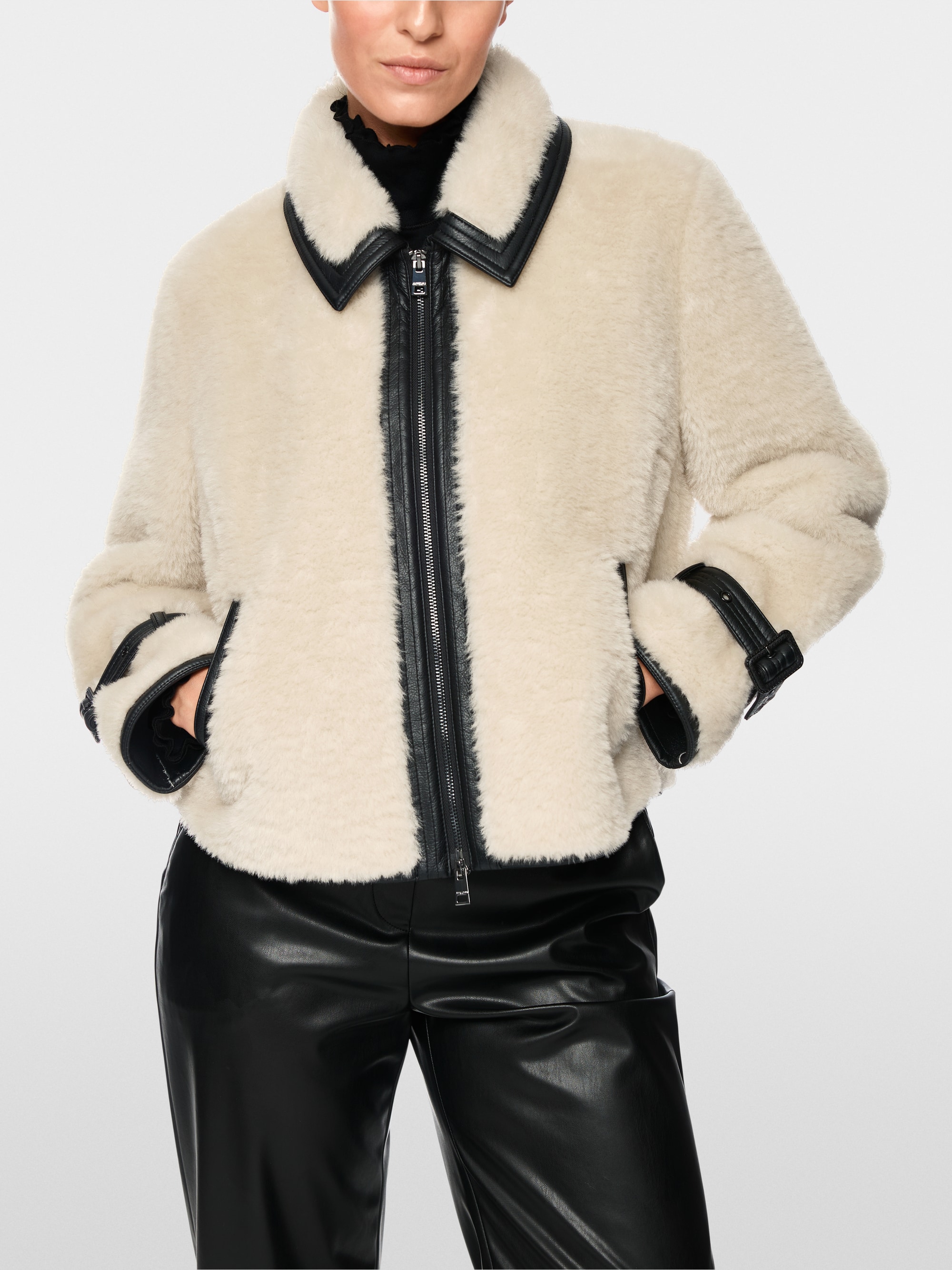Faux fur jacket with strap detail
