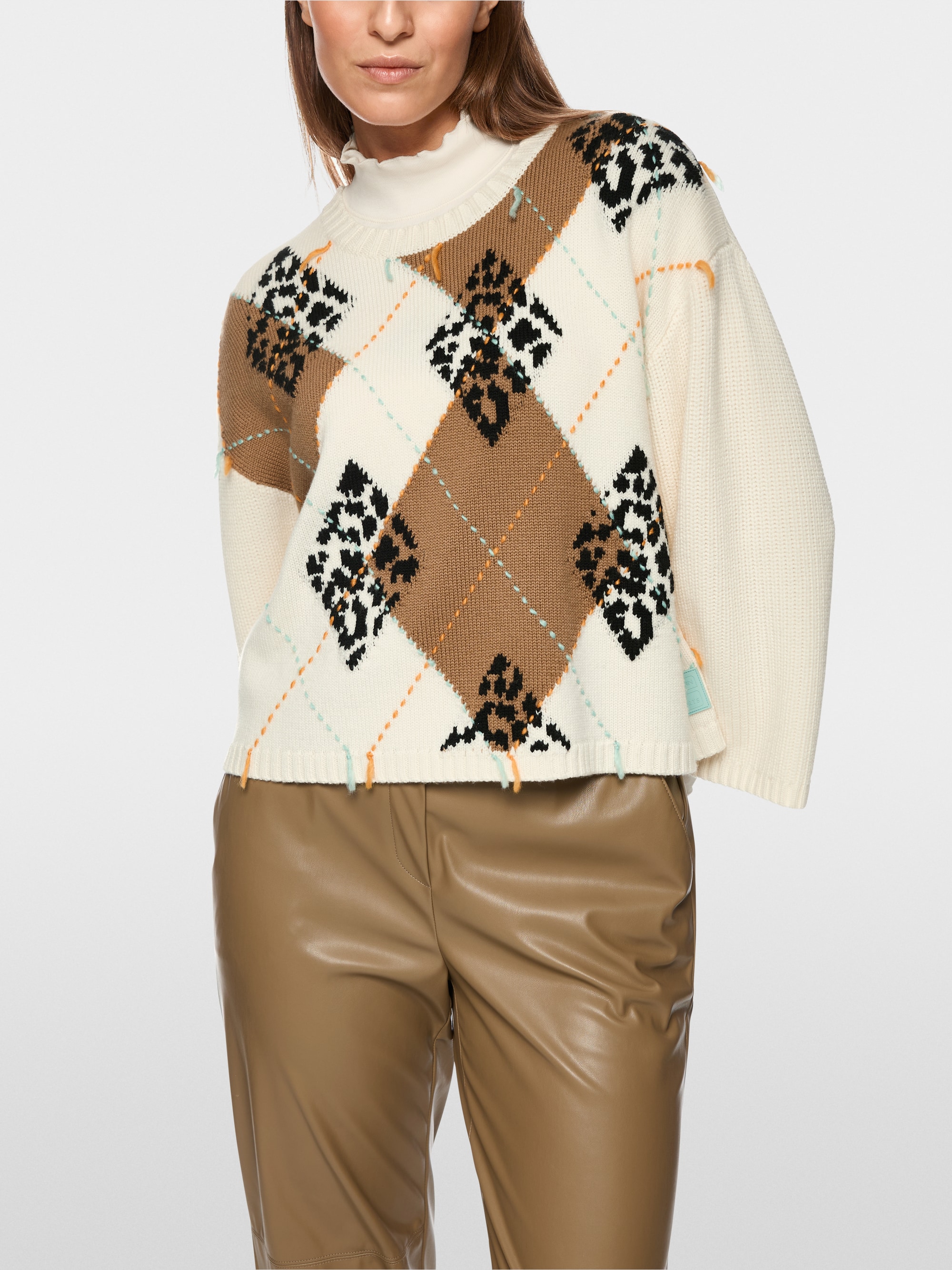 Wool jumper with argyle and fringes