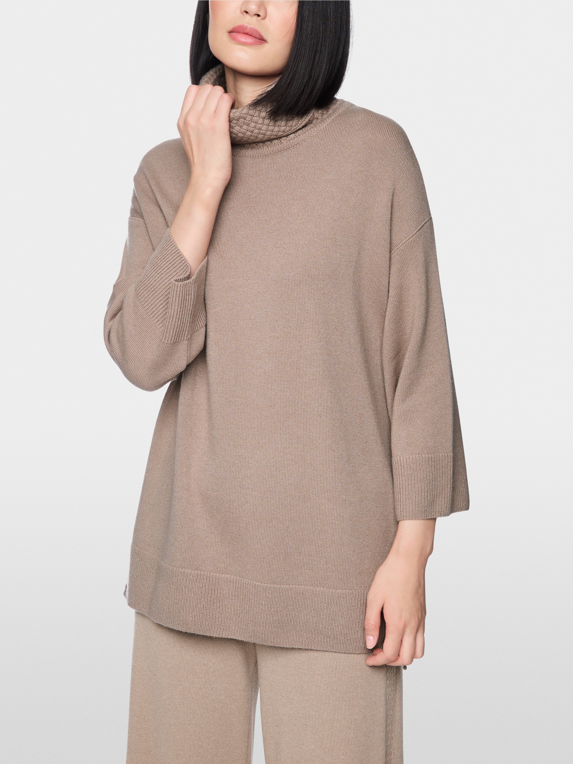 ‘Knitted in Germany’ turtle neck jumper