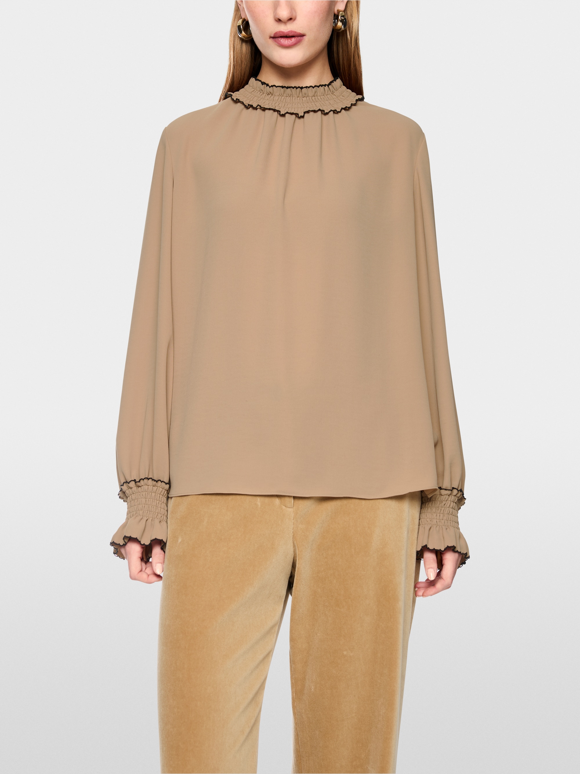 Loose-fitting blouse with smocking