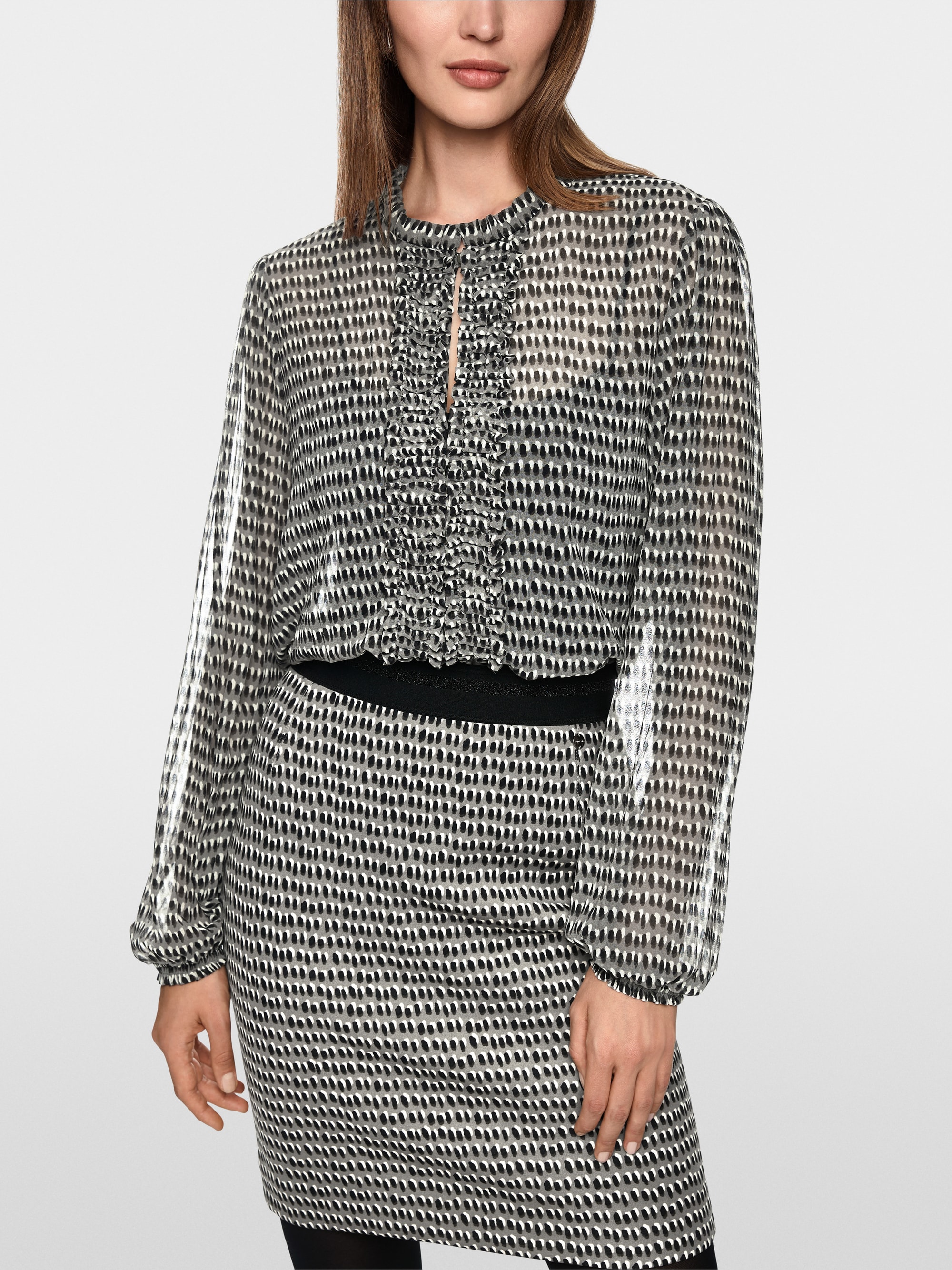 Semi-transparent blouse with ruffles